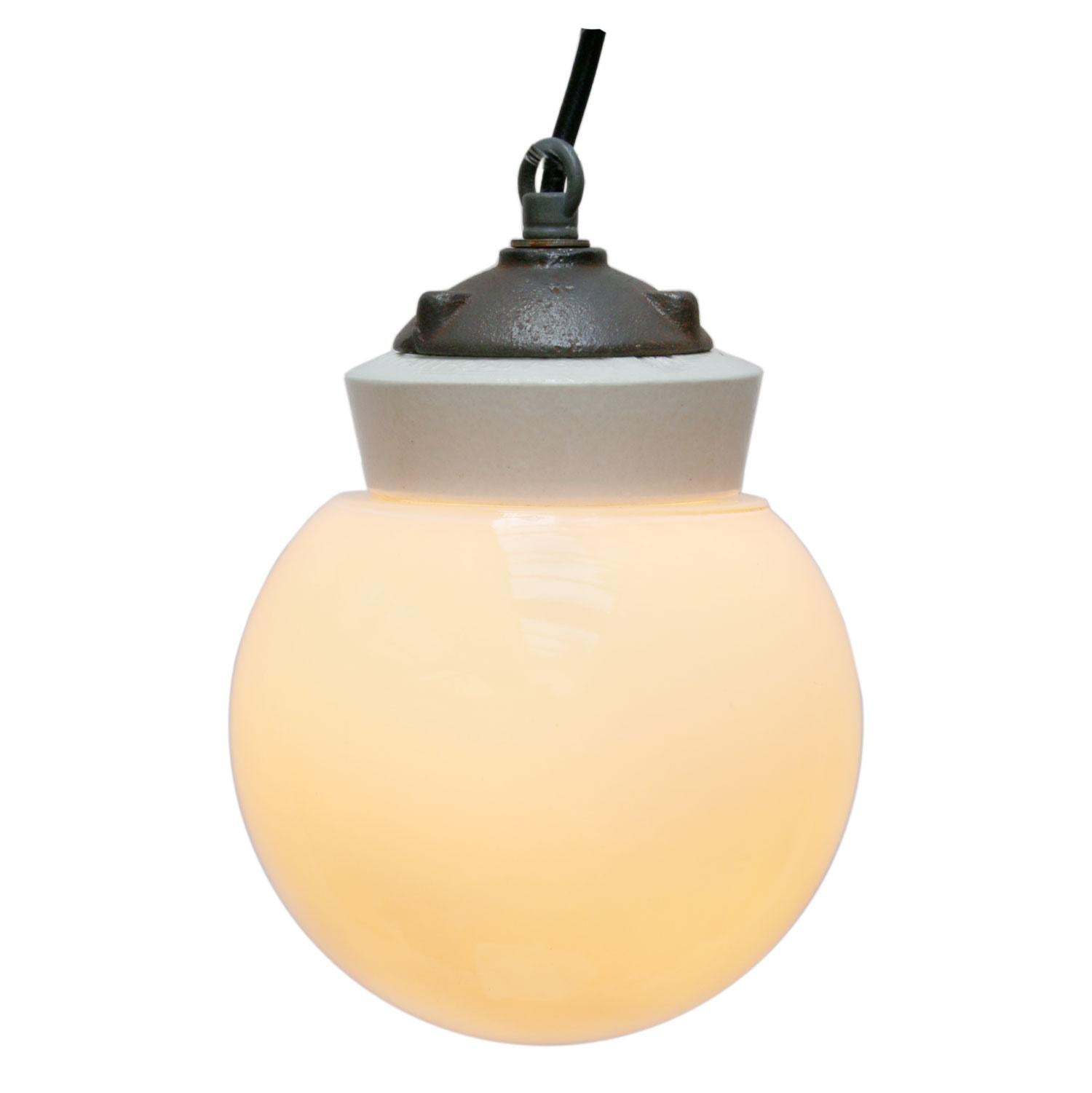 Porcelain Industrial hanging lamp. White porcelain. Cast iron and white Opaline glass.
Two conductors. No ground.

Weight: 1.7 kg / 3.7 lb

Priced per individual item. All lamps have been made suitable by international standards for incandescent