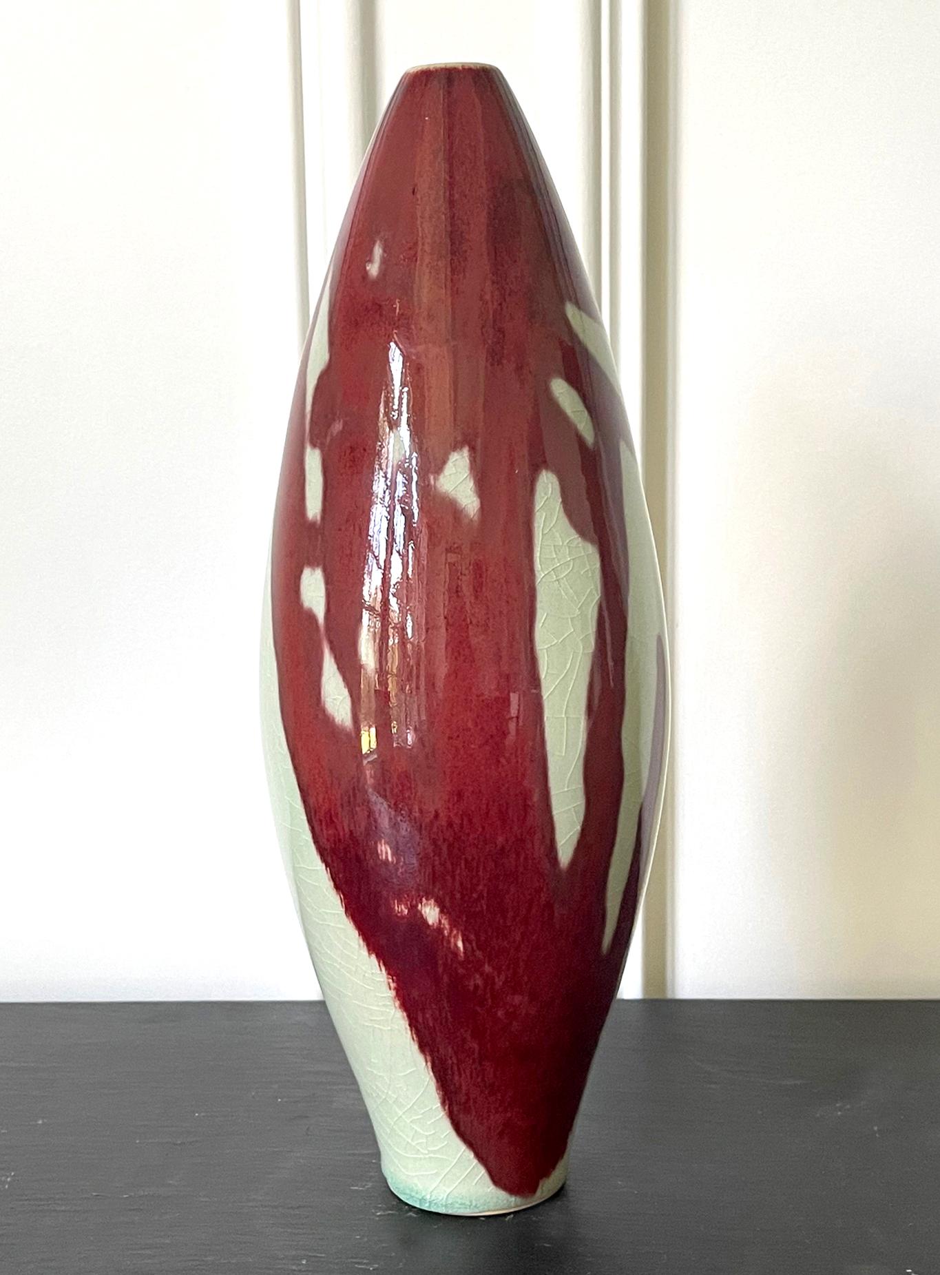 A spindle form porcelain vase by Brother Thomas Bezanson (1929-2007). As a modern interpretation of 