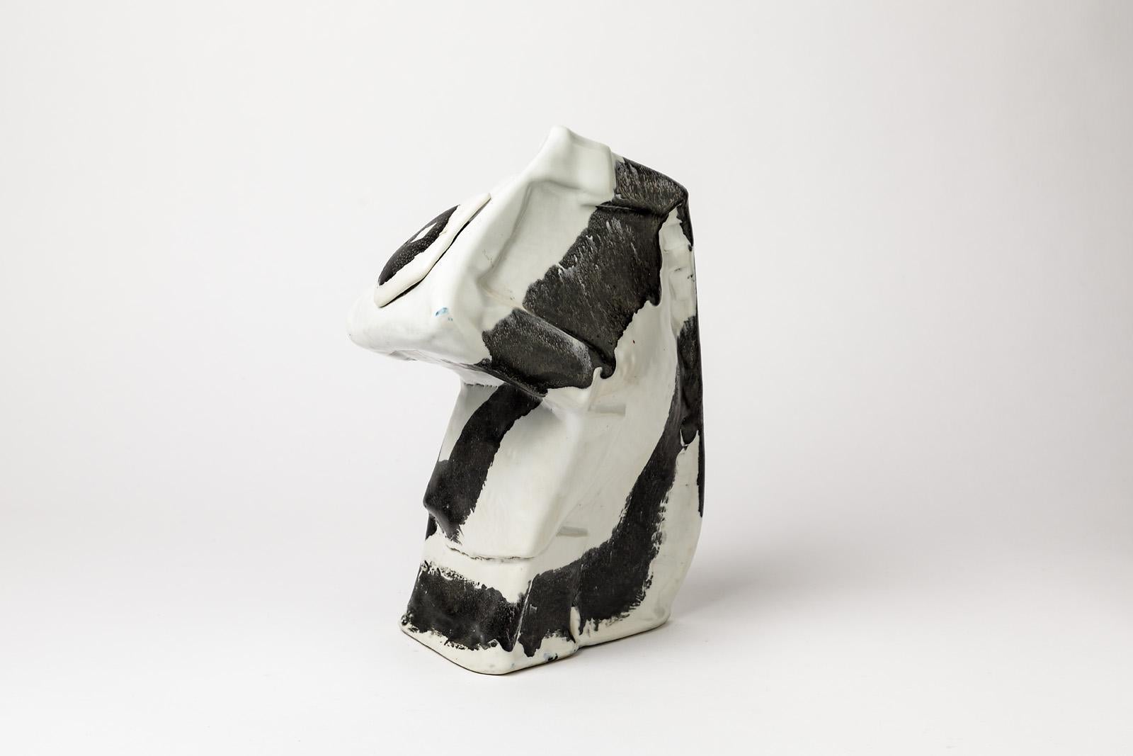 Michel Lanos

Sculptural ceramic porcelain vase or sculpture by Michel lanos, french artist, circa 1975.

Elegant black and white colors.

Perfect original condition.

Signed under the base.

Dimensions: 30 x 22 x 12cm.