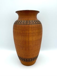 Vaso cinese di porcellana avvolto nel rattan