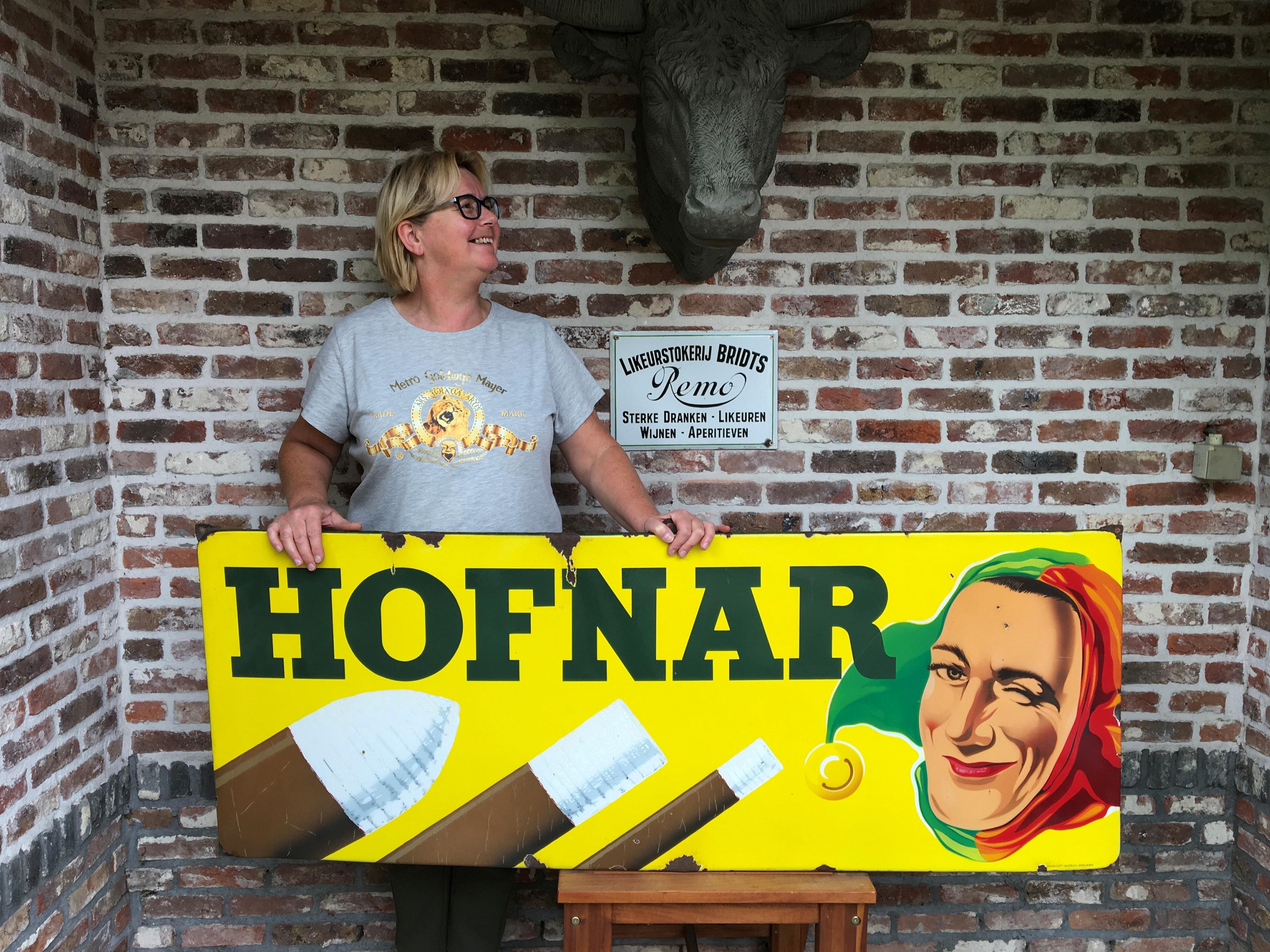 Great looking porcelain cigar sign. 
This large enamel sign for cigars dates from the 1950s and was made by Langcat Bussum Holland for the Dutch brand 