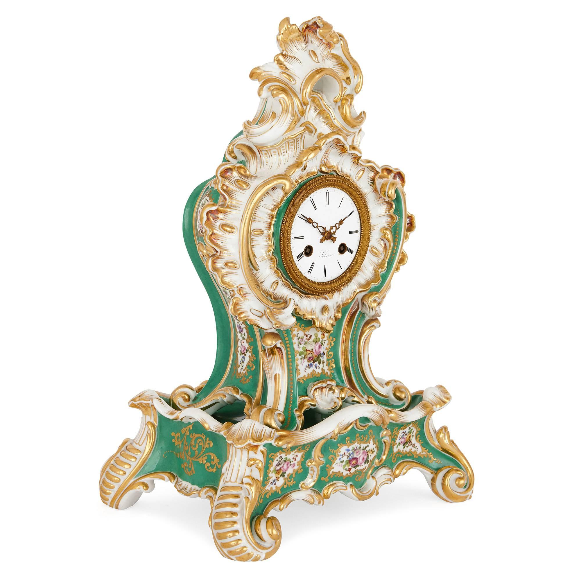 This antique porcelain mantel clock demonstrates the 19th century nostalgia for the delicately elegant decorative arts under King Louis XV, also known as the Rococo style. 

Crafted by celebrated porcelain artist Jacob Petit, this exquisite clock