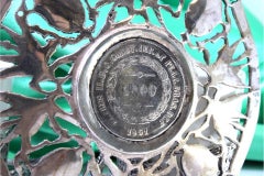 Porcelain coffee cups with silver stands featuring coats of arms and cutouts
