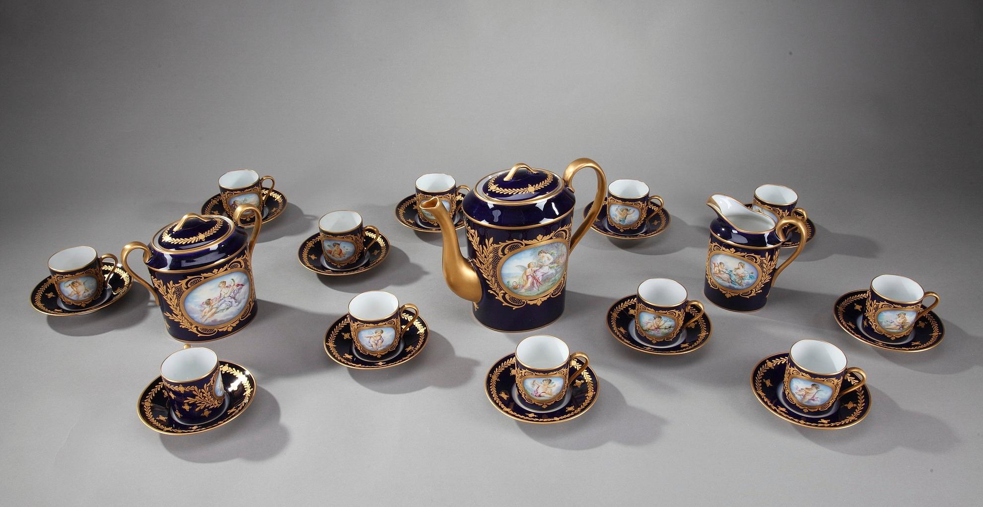 19th century antique china coffee service in Sevres taste. It comprises: a coffeepot, a milkpot, a sugar bowl and 12 cups with saucers. Each of the 27 exquisite pieces displays delicately hand painted cartouches of mythological characters within