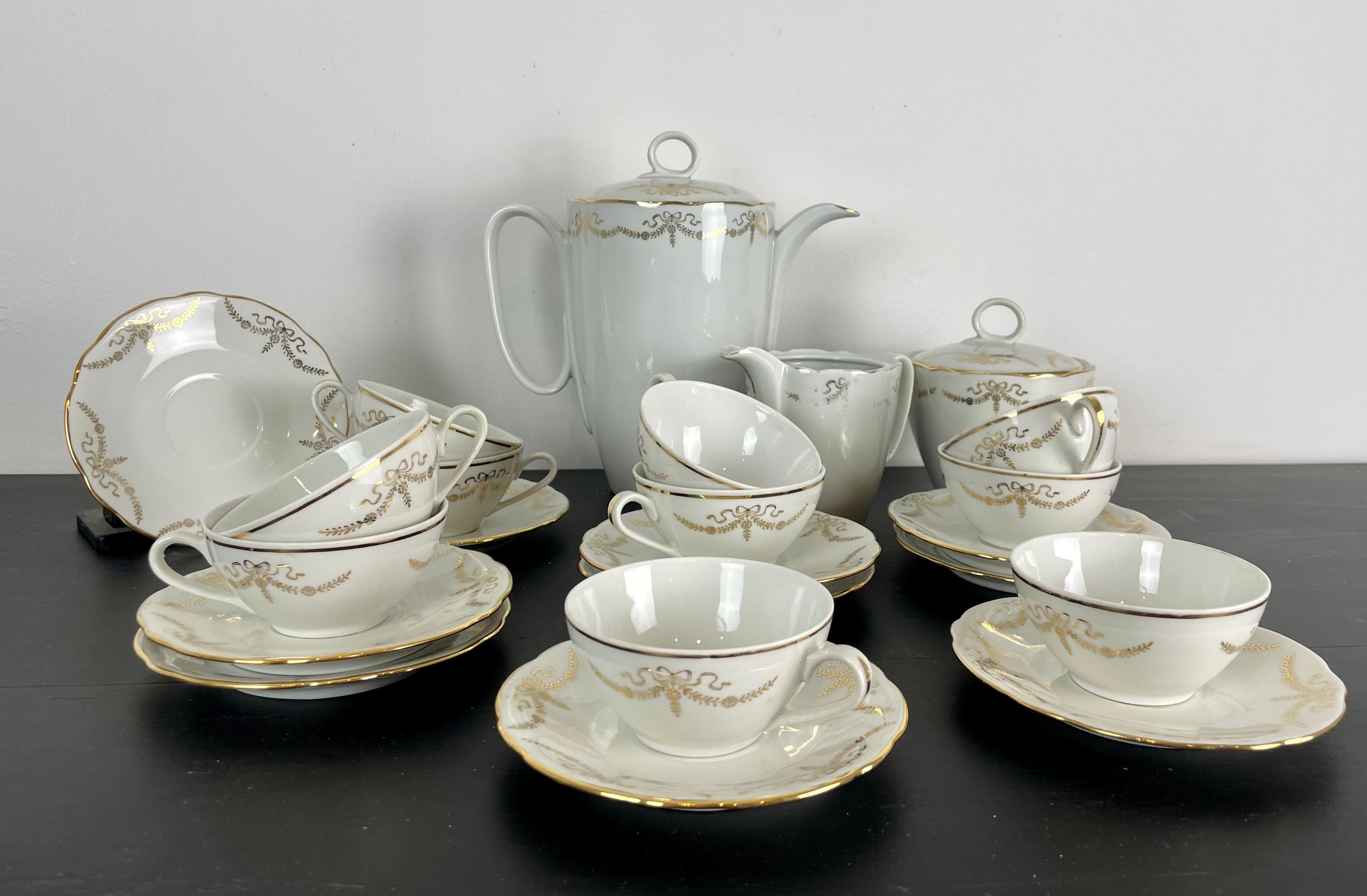 Nice coffee or tea service from the first half of the 20th century for 10 people.
Beautiful porcelain quality, white with fine gold edging and gold patterns on each piece.
High Porcelain of Berry, Compagnie Nationale de porcelaine, France

Measures: