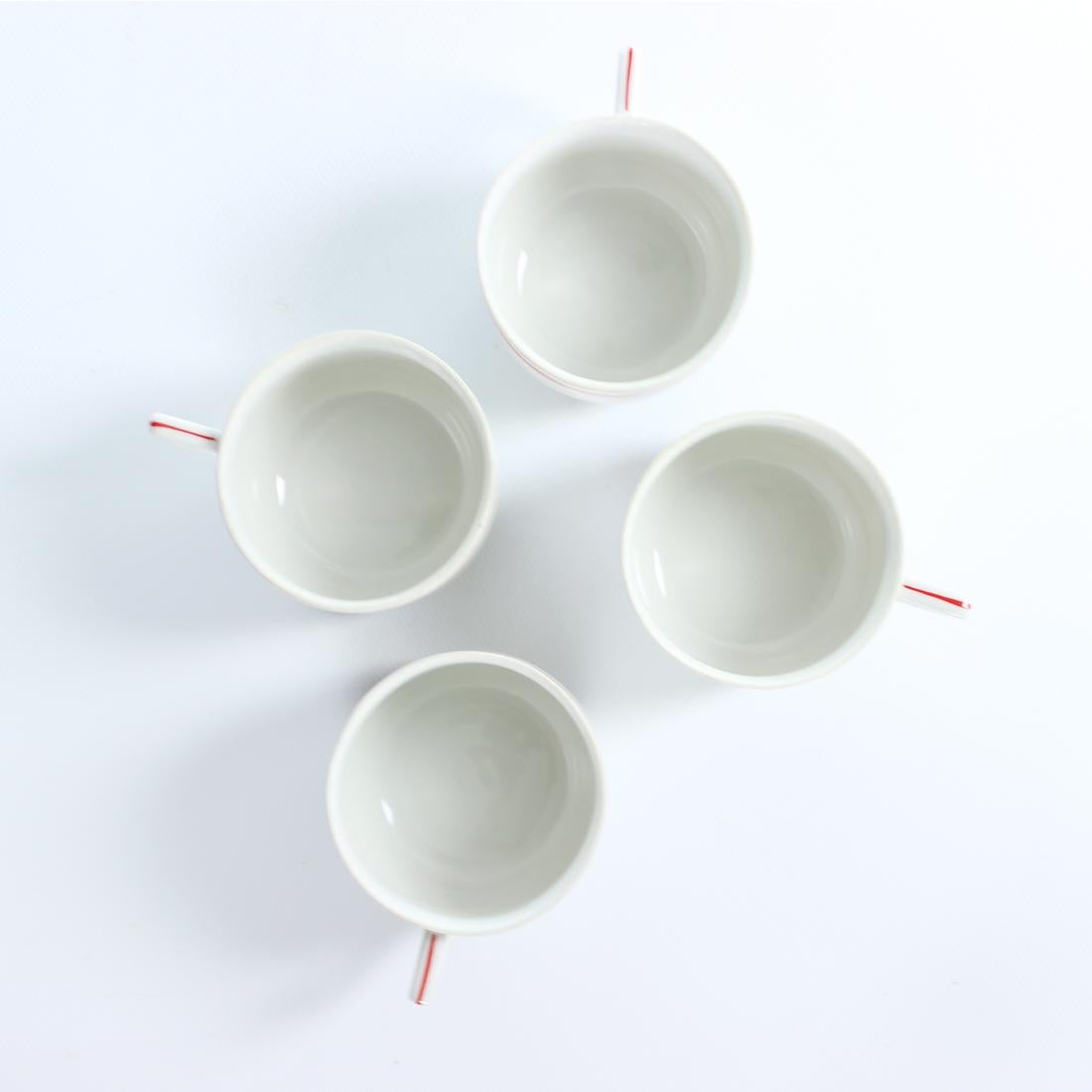 Beautiful set of 4 porcelain tea/coffee cups from Mid-century era. Produced in Czechoslovakia. Original label stamped in the bottom of each cup. The cups are elegant and simple in a beautiful white porcelain with a couple of red stripes around the