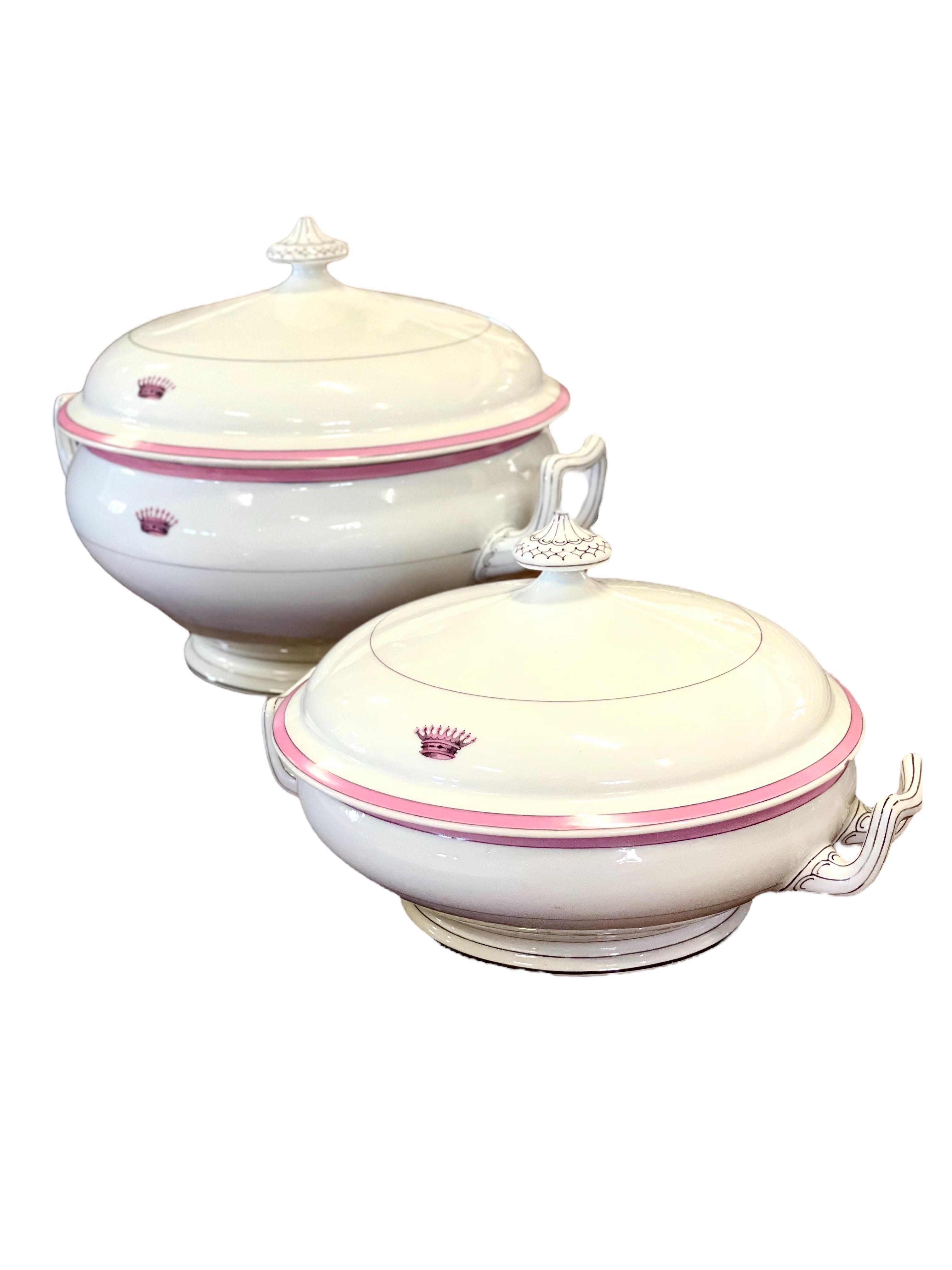 A gorgeous dinner service from the Maison Charles Pillivuyt et Cie, a manufacturer of high-quality porcelain founded in 1818. Each piece is hand-painted with a delicate rose- pink border and features an elegant coronet monogram. The undersides are