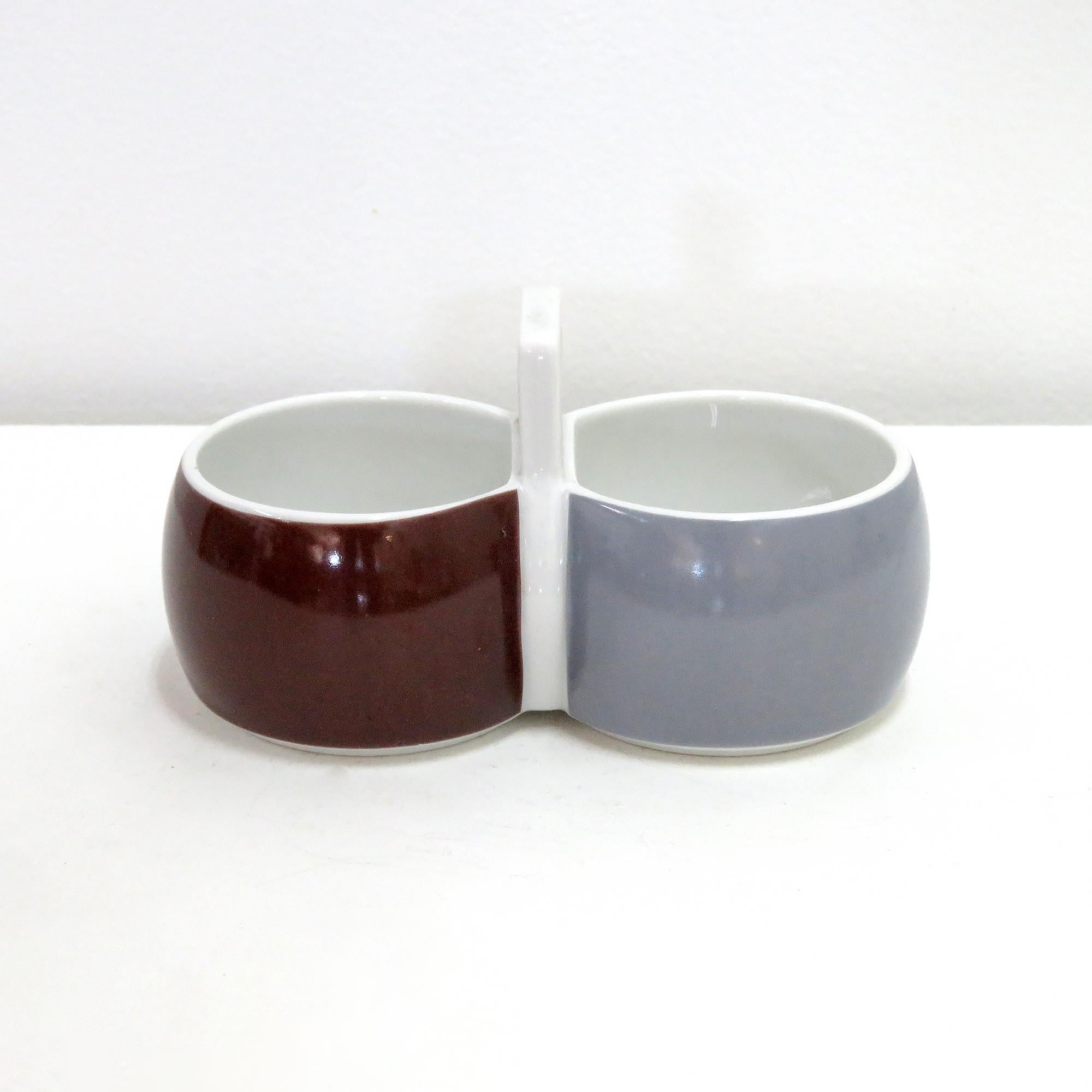 wonderful double dip bowls from the 'Chromatic' series, designed by Gerald Gulotta for Arzberg Porzellan, Germany between 1971-73. These double bowls are great for small snacks and dips. One of the bowls is part of the 'Goldbraun' sub series and the