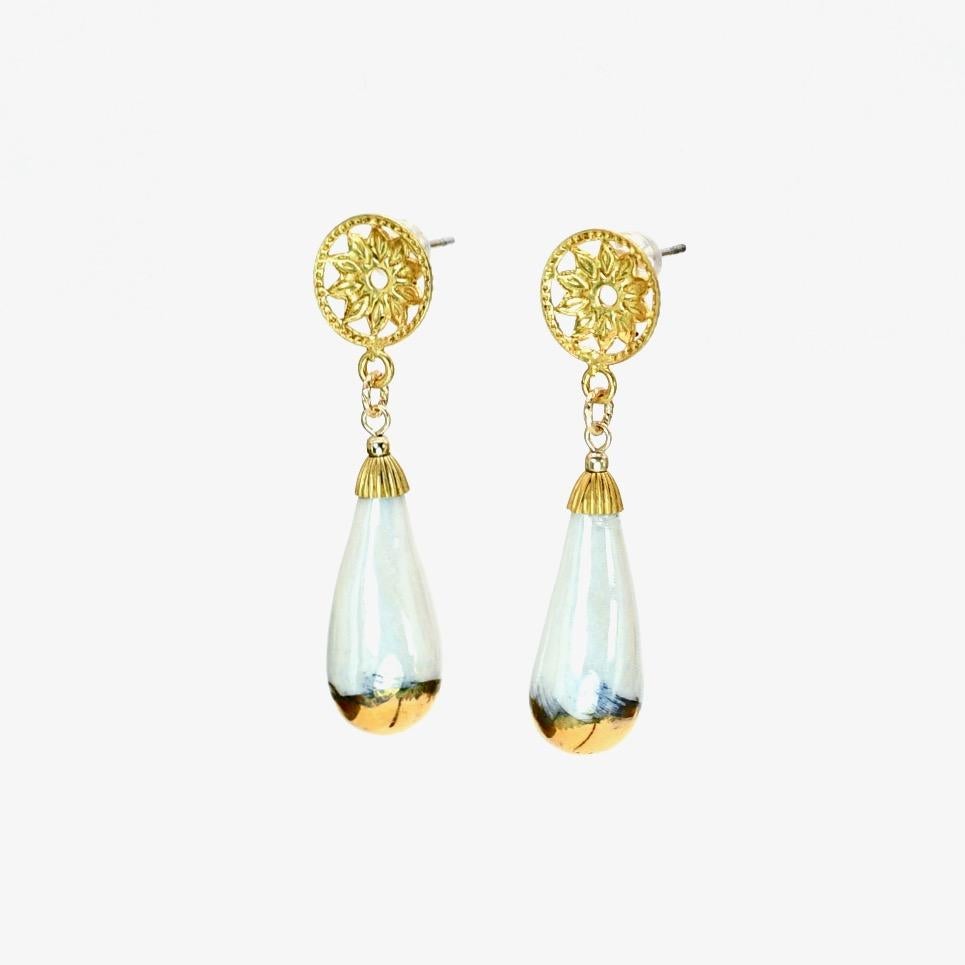 Porcelain  24K gold  Mother of pearl Handmade in London

Experience sophisticated luxury with GHYLL Porcelain Earrings. These exquisite earrings are made from the whitest porcelain and resemble a delicate drop of water. Fixed on vintage posts from