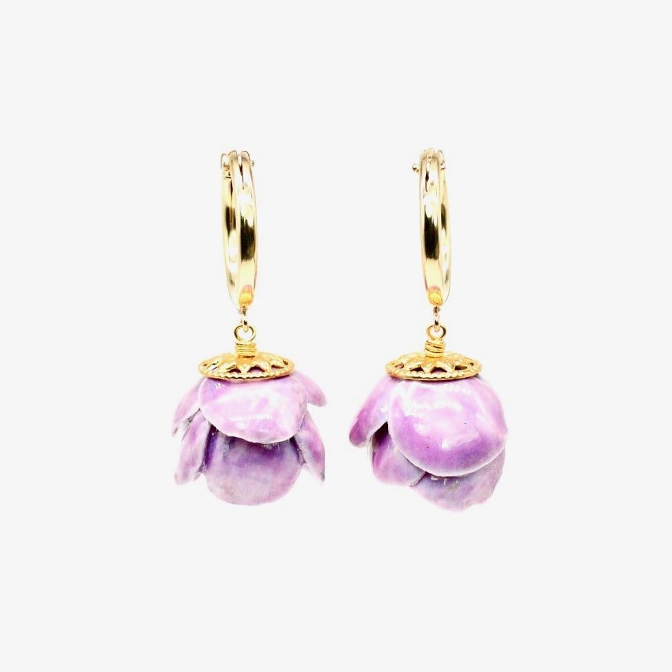 Porcelain  Mother of pearl  Handmade in London 
Indulge in elegance with our LAURA Porcelain Ceramic Earrings. Meticulously hand-assembled petal by petal, each peony flower pendant is one-of-a-kind. Both adorned with mother of pearl and dangle on a