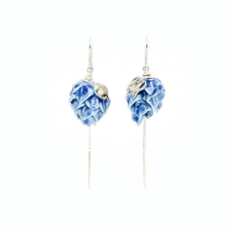 Porcelain  Sterling Silver threads  Platinum  Handmade in London 

Indulge in the timeless elegance of the MARINA Porcelain Ceramic Earrings. Handcrafted from delicate porcelain and adorned with a lustrous blue cobalt glaze, these earrings exude