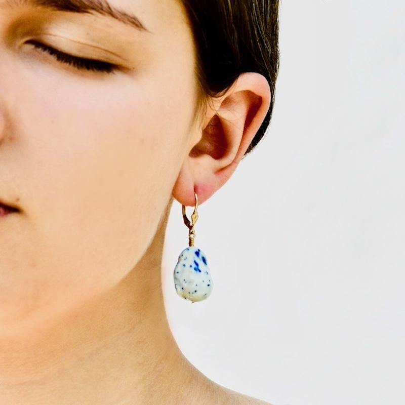 Porcelain  Handmade in London  Ceramics

Enhance your fashionable appearance with NEELA Porcelain Ceramic Earrings. These earrings are meticulously made from the highest quality porcelain, boasting a dazzlingly vibrant white hue with flowing azure
