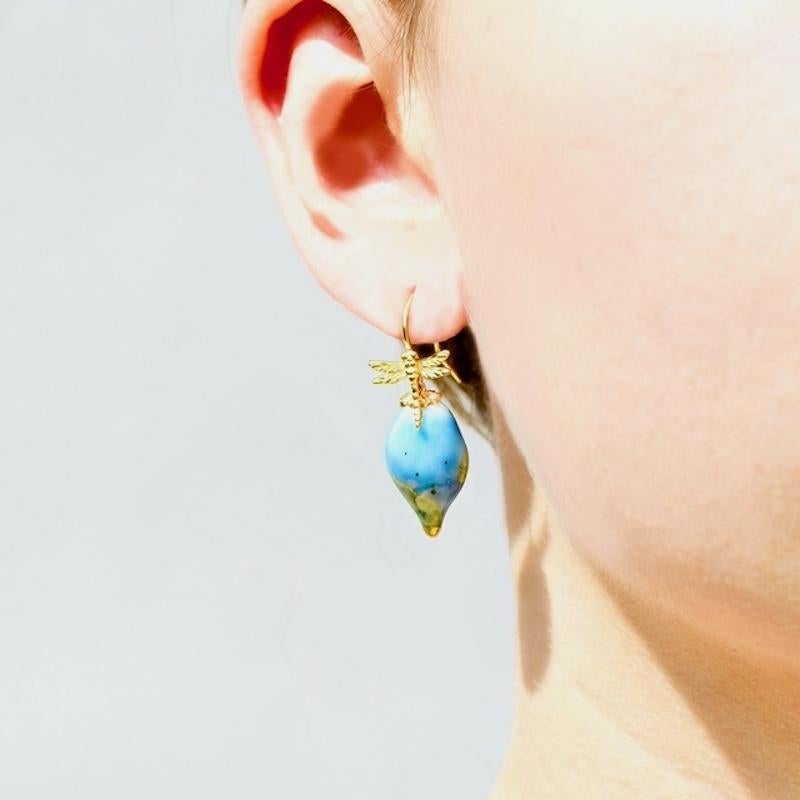 Porcelain  14kt Gold Plated Sterling  24K Gold  Handmade in London  Ceramic

Experience the refined splendor of ODONATA Porcelain Ceramic Earrings. Crafted from the utmost quality porcelain, each pendant evokes a glistening droplet of water in a