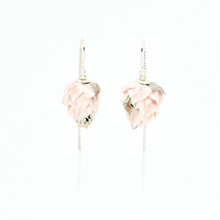 Porcelain  Sterling Silver threads  Platinum  Handmade in London 

Indulge in the ultimate luxury with our RUMINA Porcelain Ceramic Earrings. Handcrafted from the finest porcelain and glazed with a gentle pink sheen, these earrings exude an air of