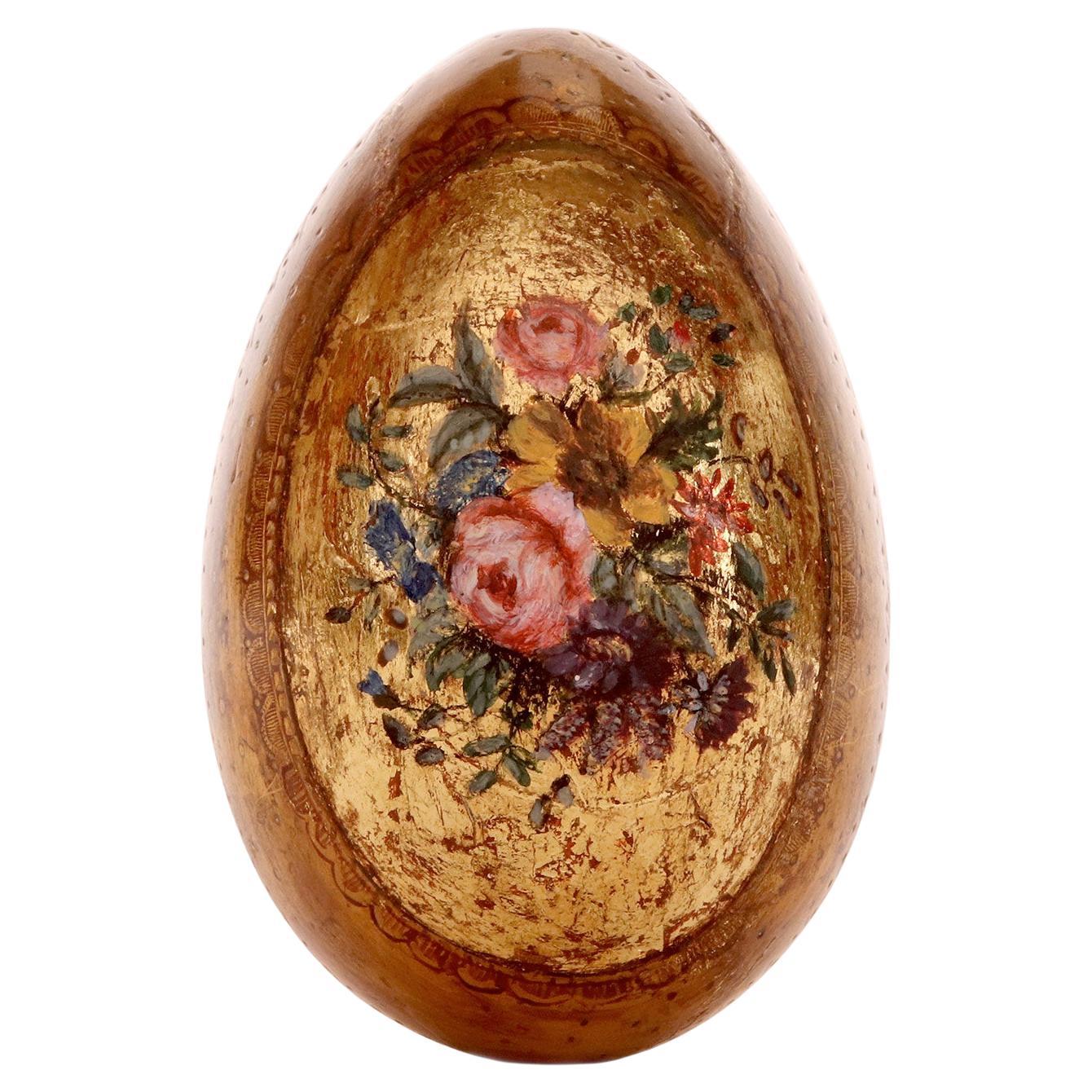 Porcelain Easter egg painted on a gold background depicting flowers, Russia 1890