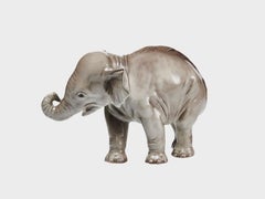 Porcelain elefant figure with trunk upwards underglaze painted
