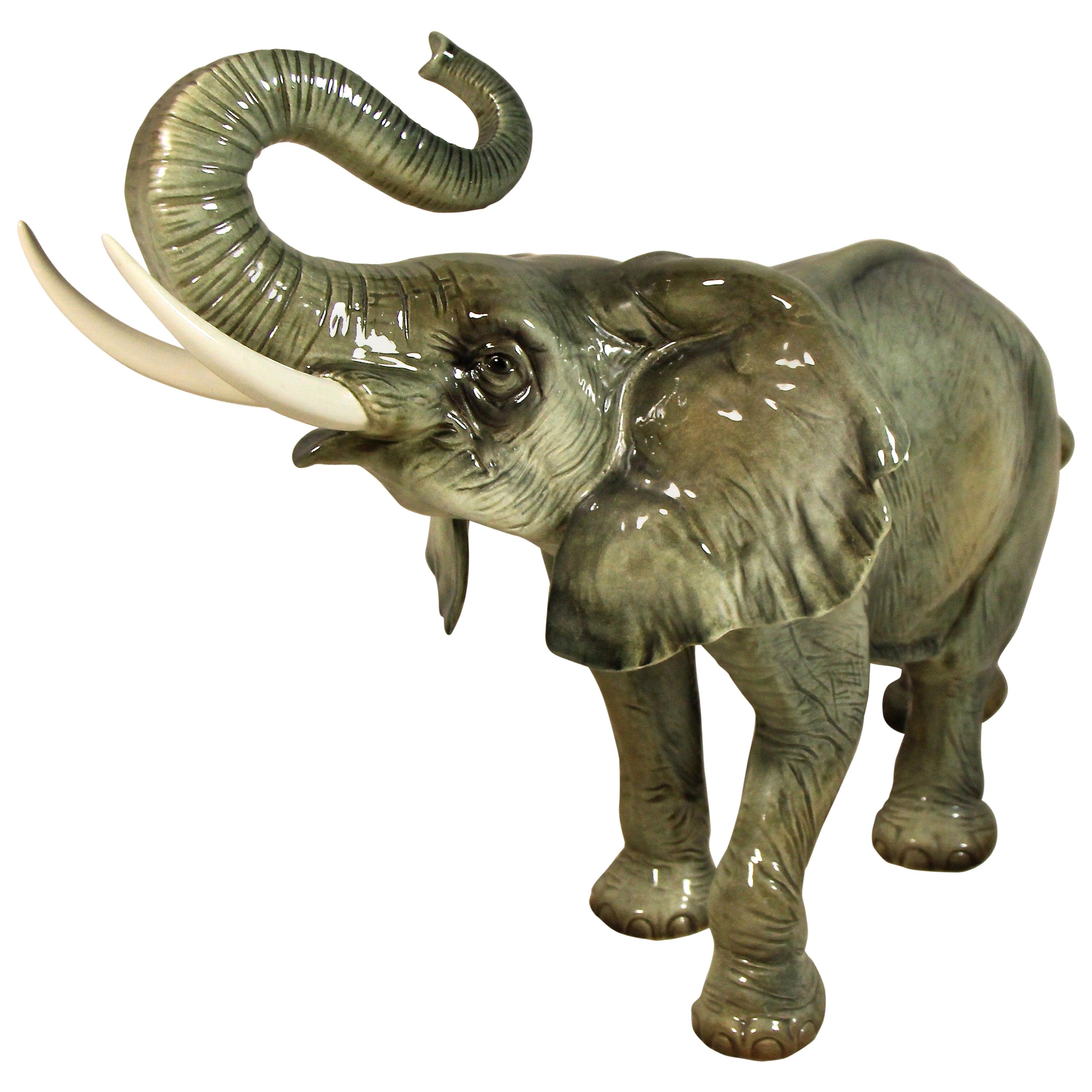 Beautiful porcelain elephants from the 20th century made by the world famous porcelain manufacture Goebel (Hummel) in Germany with nice playful details. The lifelike design and the amazing grey painting makes this big porcelain elephants a highly