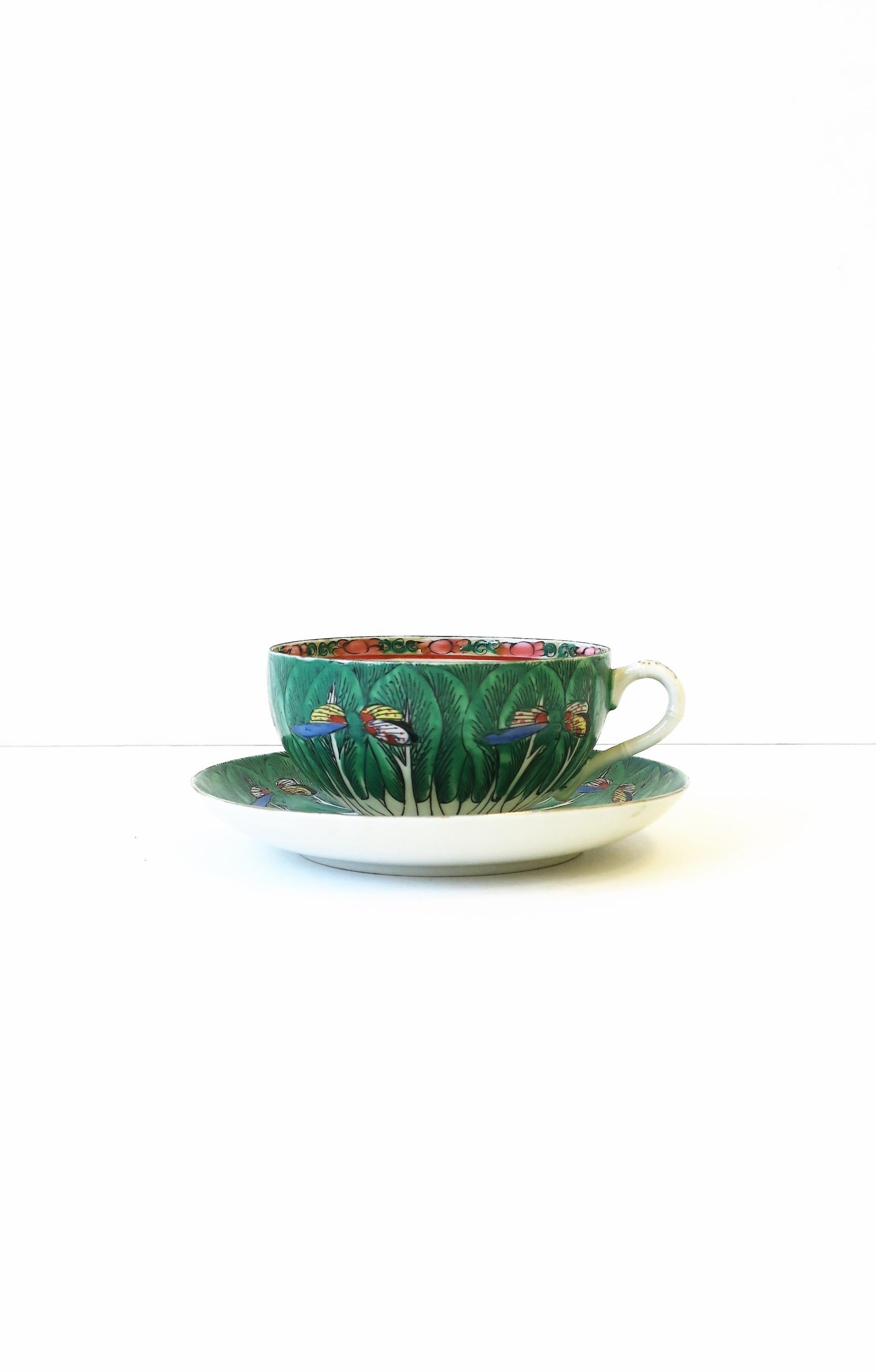 A very beautiful and rare porcelain Famille Verte cabbage leaf and butterfly pattern coffee or tea cup and saucer set, circa early 20th century, Chinese Export. Porcelain is covered in a leaf and butterfly pattern, painted in beautiful rich hues;