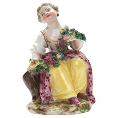 Statuetta in porcellana “Ragazza con ghirlanda di fiori” della Fabbrica Imperiale e Reale di Vienna