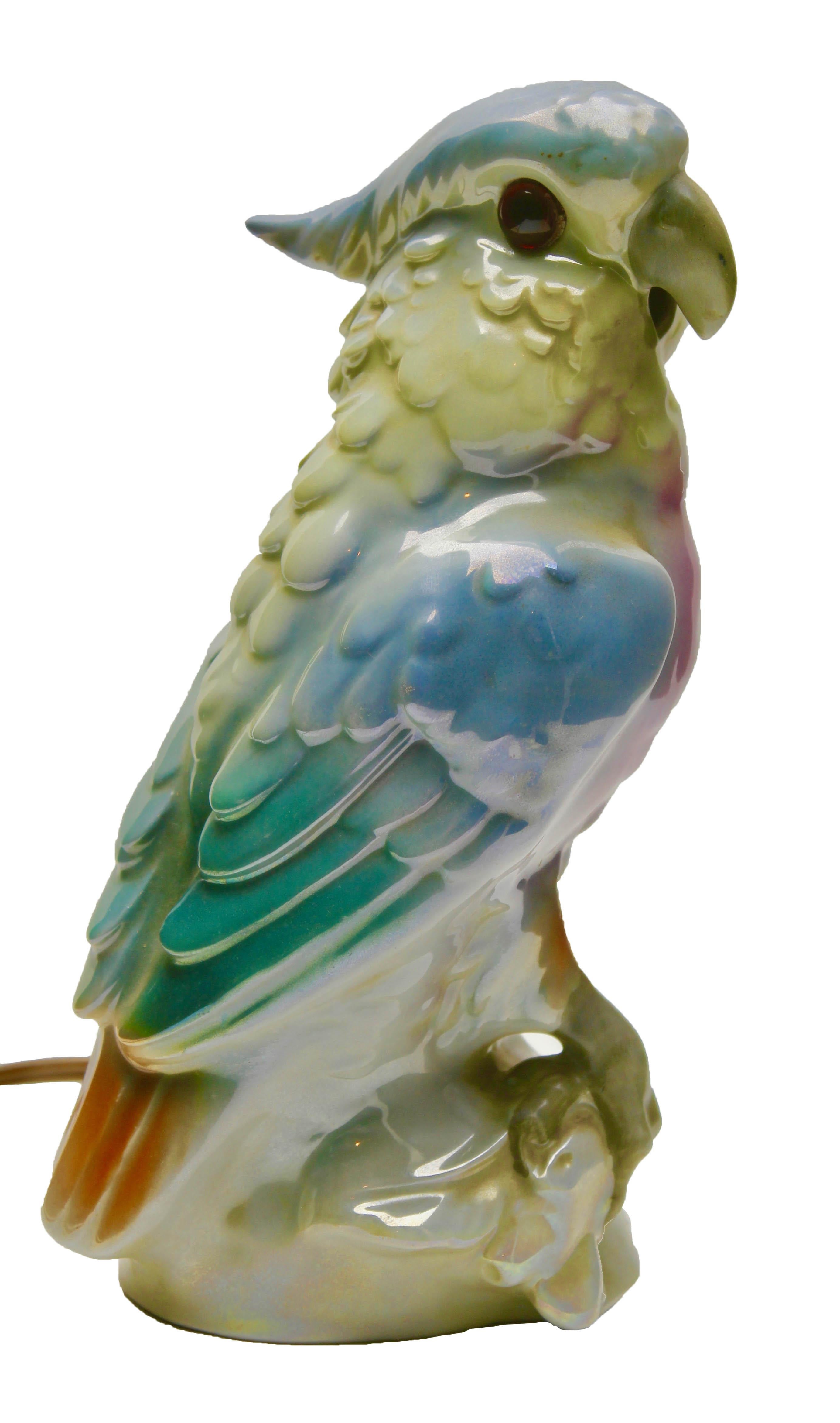 Germany, 1930s, excellent condition
Porcelain figurine, air purifier or table lamp. Parrot from the 1930s. Undamaged original condition. The lighting works. A small container on the back can be filled with fragrance oil. The oil evaporates due to