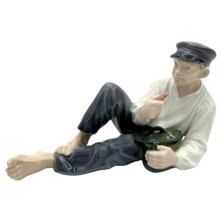 A Royal Copenhagen figure of a boy whittling 905 19cm | 13th February