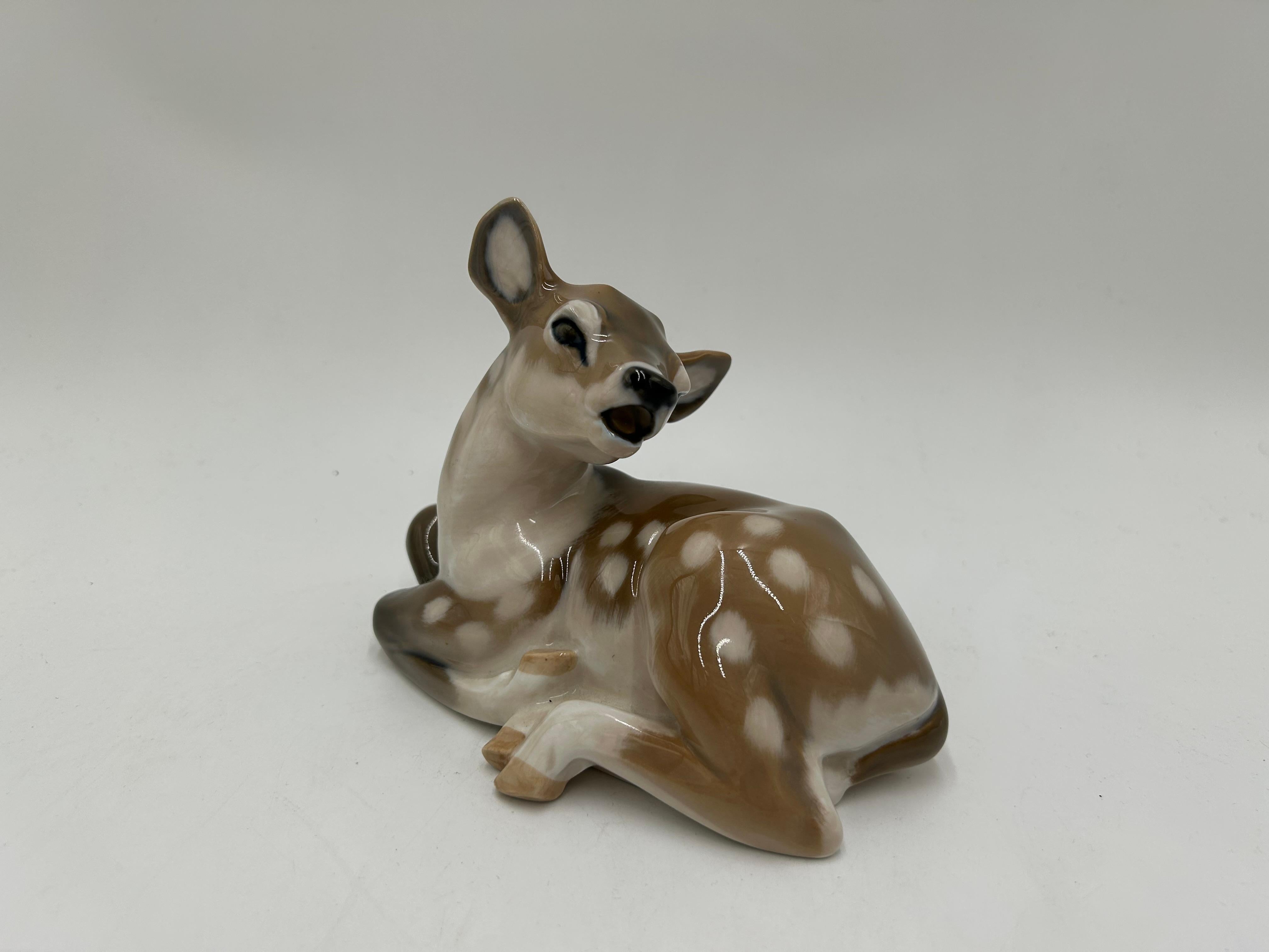 Porcelain figurine of a deer model #2609
Produced by the Danish manufacture Royal Copenhagen
Mark used in 1969-1973.
Very good condition, no damage
Measures: Height: 13cm
Width: 16cm
Depth: 9cm