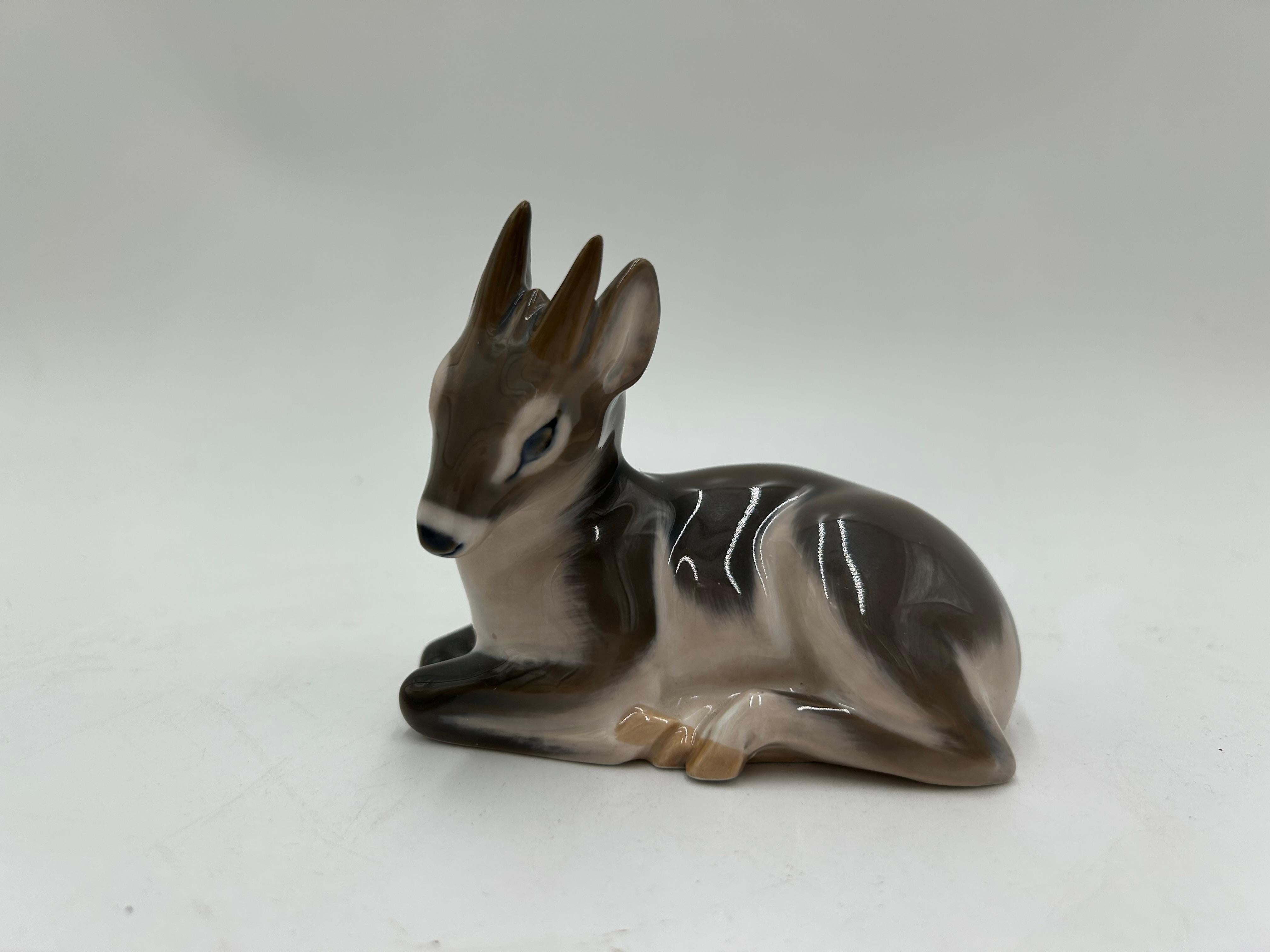 Porcelain deer figurine model #2648
Produced by the Danish manufacture Royal Copenhagen
Mark used in 1974-1978.
Very good condition, no damage
Measures: height: 9cm
width: 11cm
depth: 6cm.