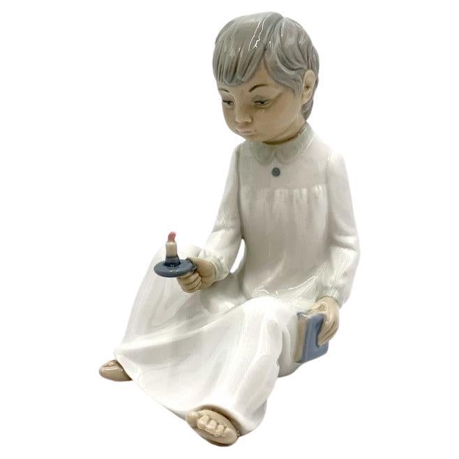 Porcelain figurine of a boy with a candle, Zahir Lladro, Spain, 1970s For Sale