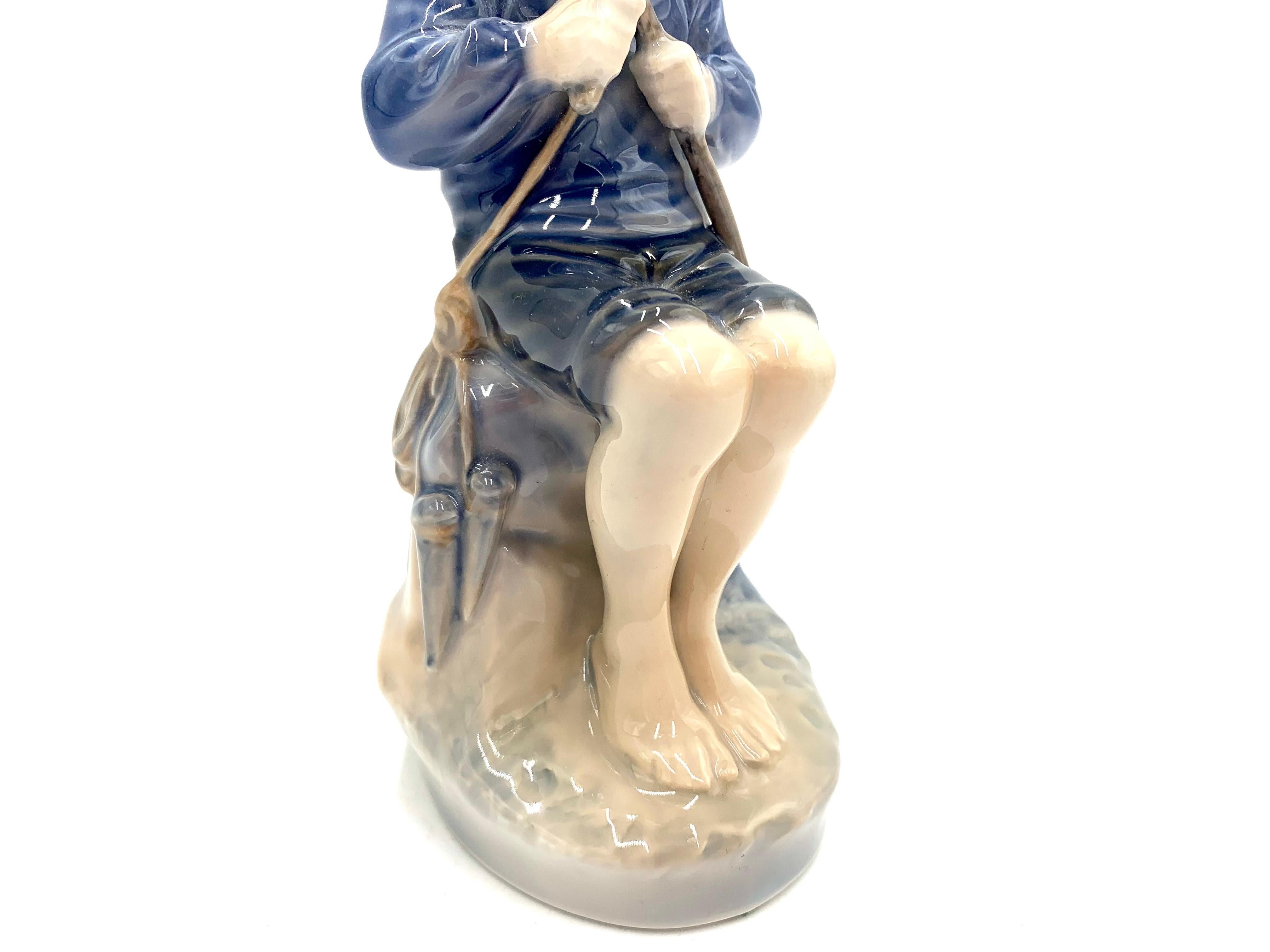 Mid-20th Century Porcelain Figurine of a Boy with a Stick, Royal Copenhagen, Denmark For Sale