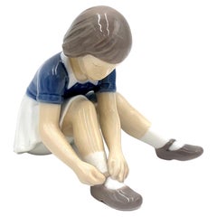 Porcelain Figurine of a Girl Lacing Her Shoes, Bing & Grondahl, Denmark, 1950s