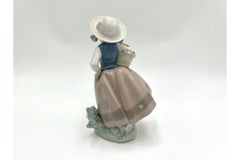 Porcelain Figurine of a Girl with a Basket, Nao Lladro, Spain
