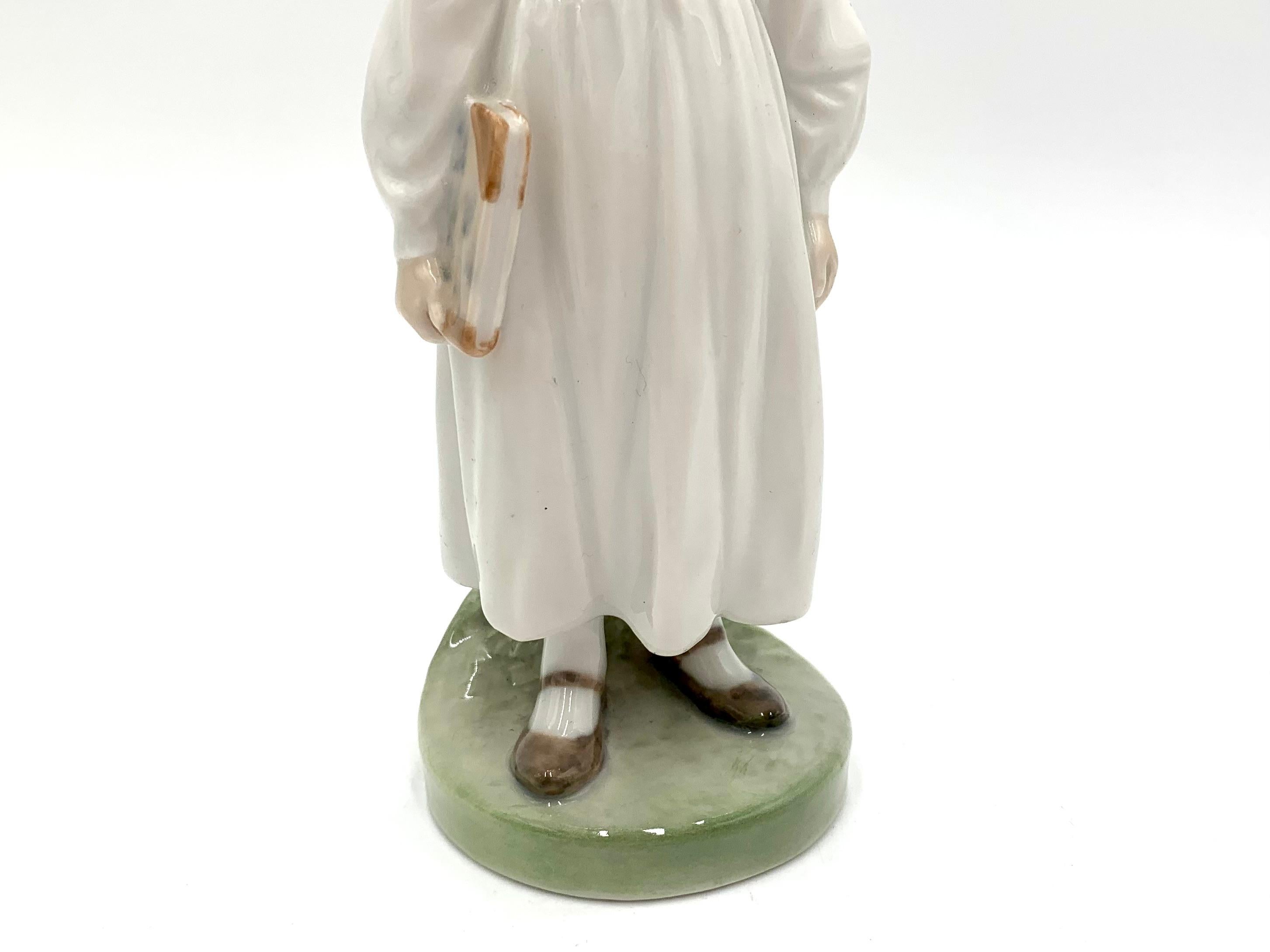 Porcelain Figurine of a Girl with a Book, Royal Copenhagen, Denmark 1