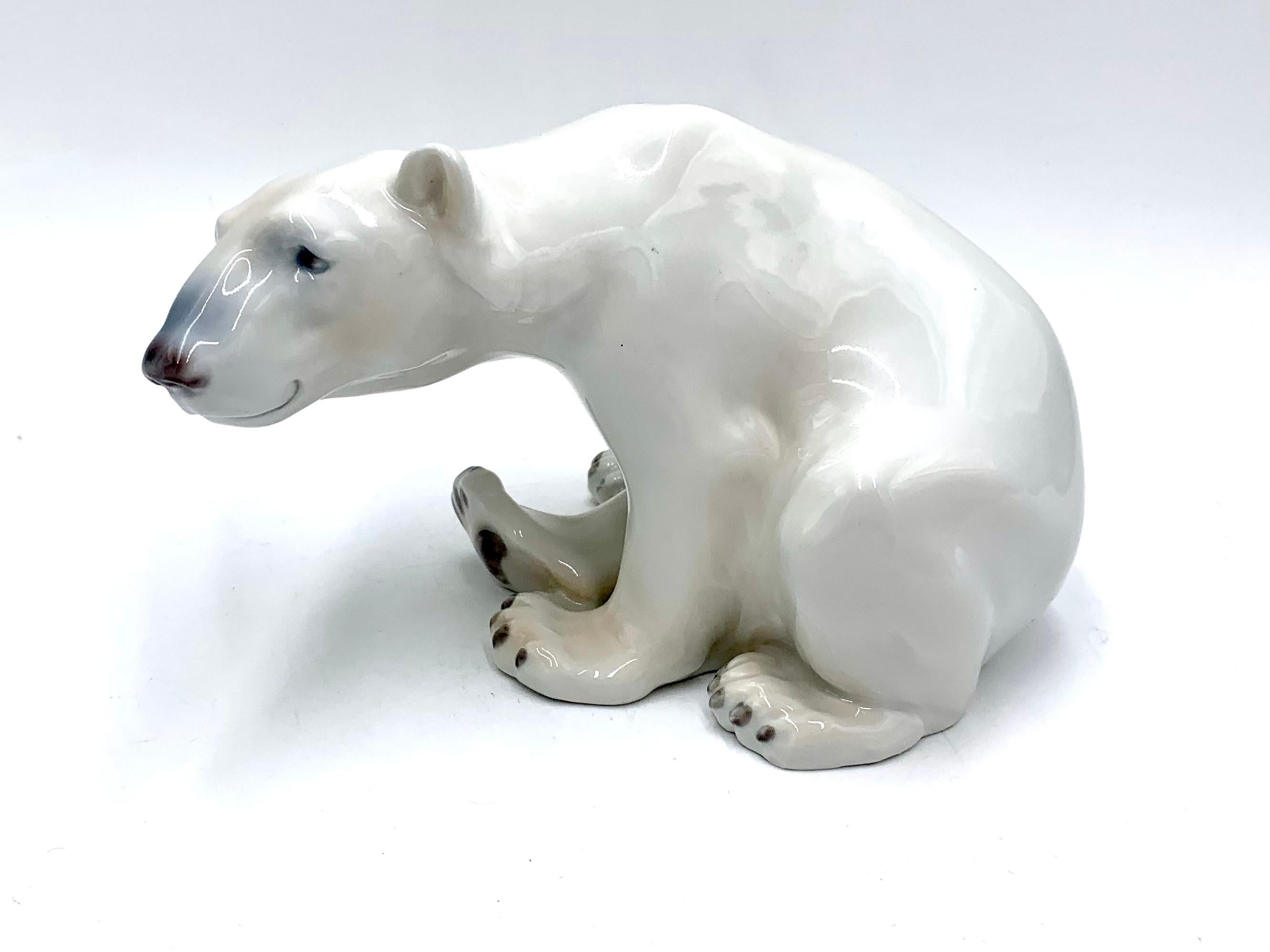 Porcelain figurine of a sitting polar bear

Made in Denmark by Bing & Grondahl

Produced in 1970-1980.

Model number # 1629

Very good condition, no damage.

Measures: height 12.5 cm width 20 cm depth 13 cm.