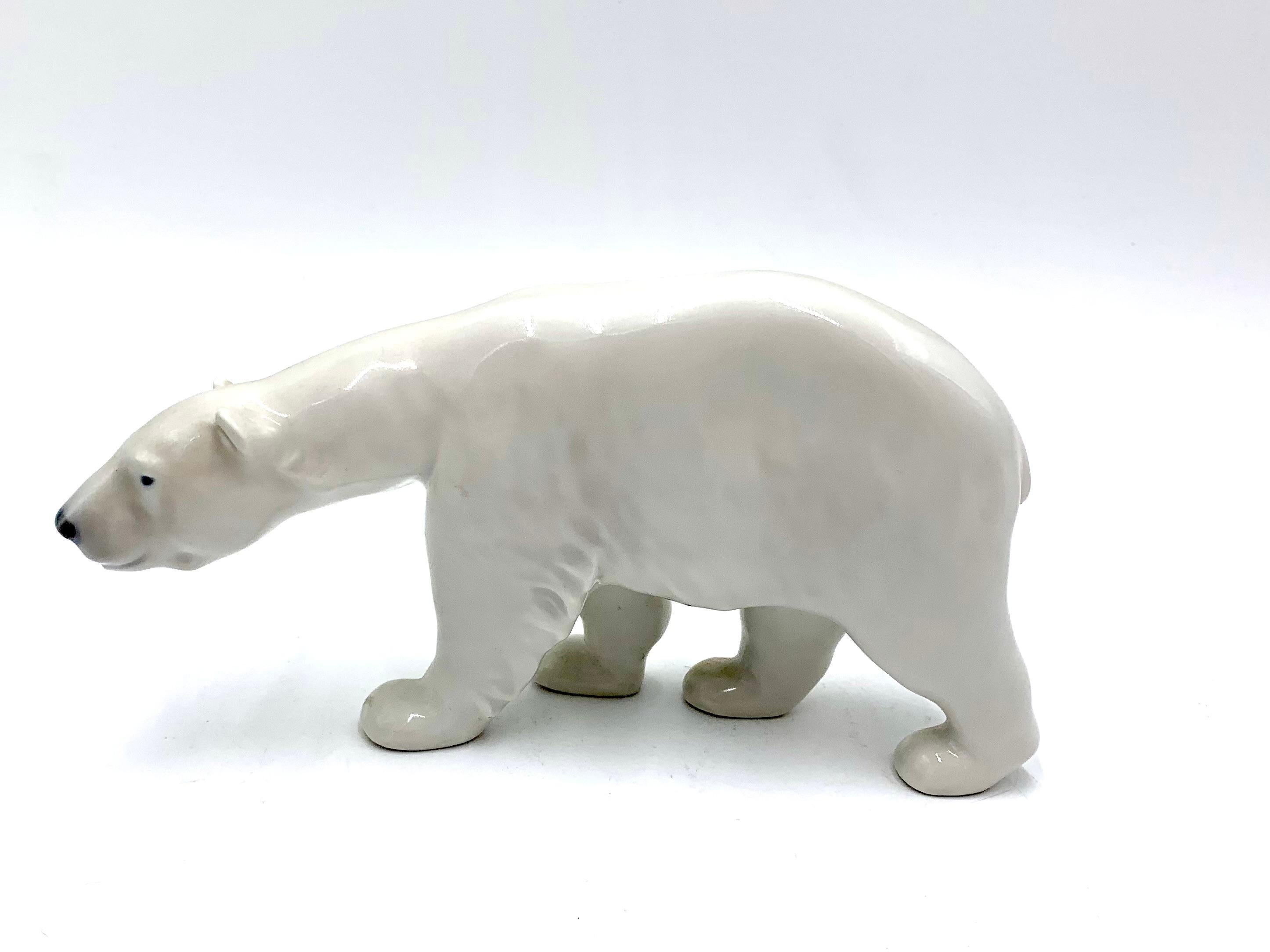 Porcelain figurine of a walking polar bear

Made in Denmark by the Royal Copenhagen manufactory

Manufactured in the 1920s.

Model number 0320

Very good condition, no damage.

Measures: height 10cm, width 18.5cm, depth 4.5cm.