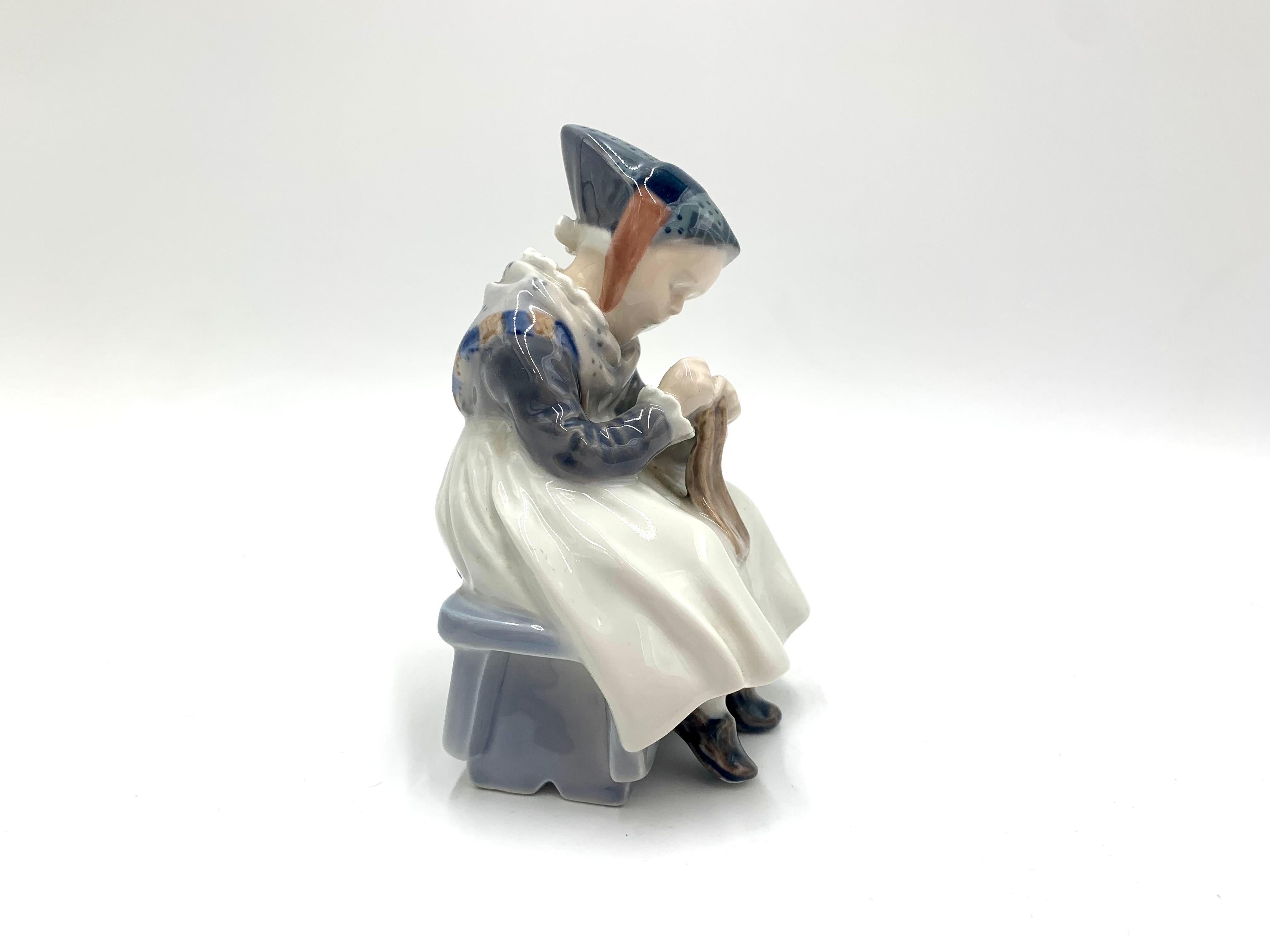 Porcelain figurine of a sewing woman in regional costume.

Made in Denmark by the Royal Copenhagen manufactory

Produced in 1974-1978.

Model number # 1314

Very good condition, no damage.

Measures: height 15 cm, width 10 cm, depth 9 cm.