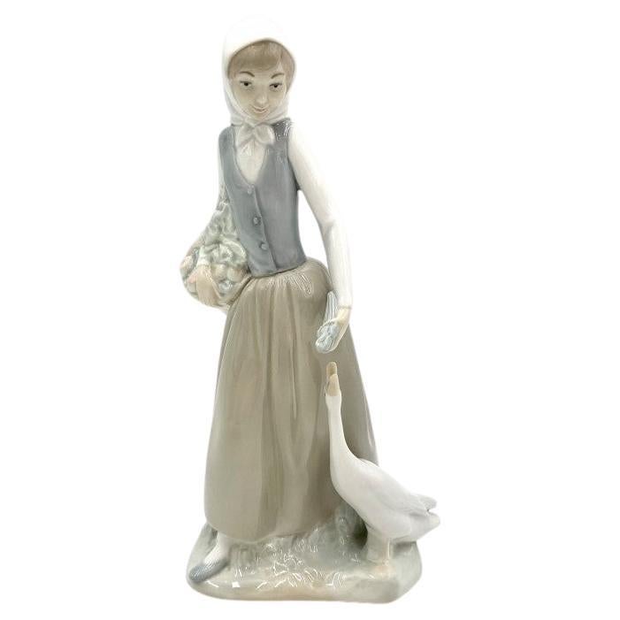Porcelain Figurine of a Woman with a Goose, Nao Lladro, Spain