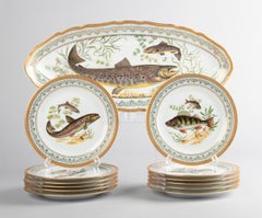 Service à poissons en porcelaine de Limoges Chadelaud avec bordures incrustées de dorures