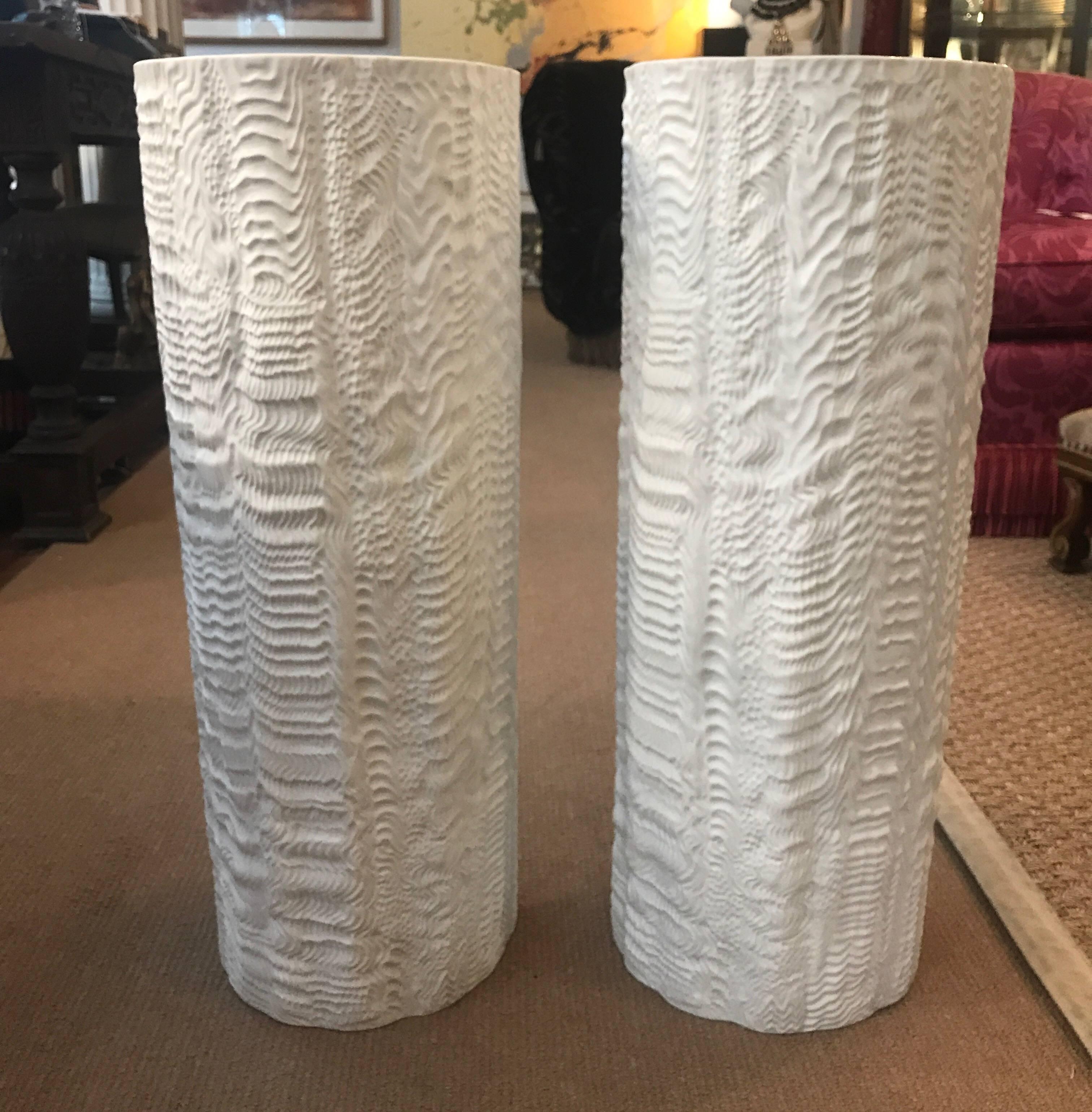 A pair of porcelain bisque white umbrella stands designed by Martin Freyer (1909-1974) for Rosenthal. The unusual organic texture in a cylindrical shape. These are a great option to use a a pair of lave vases, very dramatic.

From 1964-1974 Martin