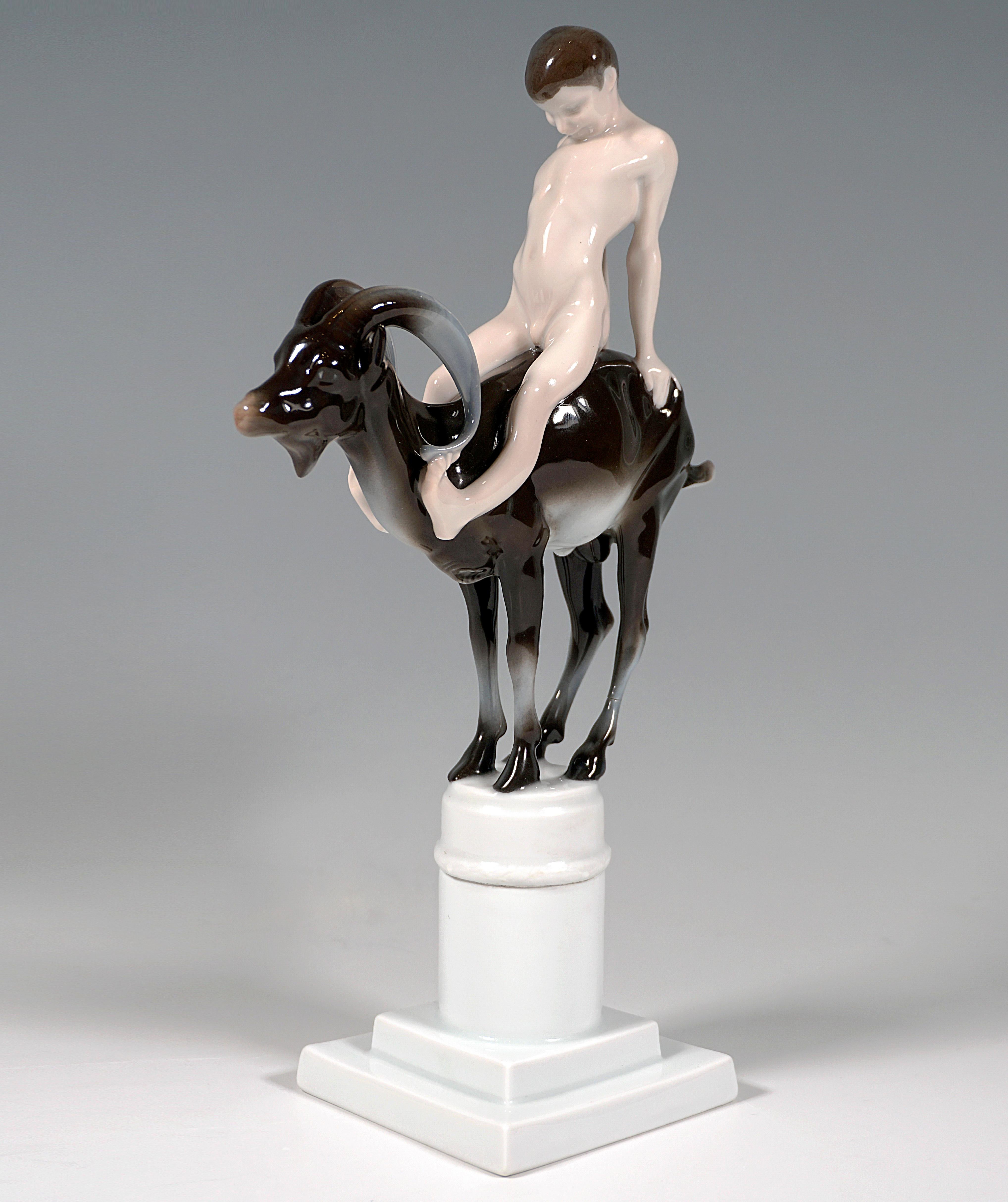 Admirable Art Nouveau Figure Group by Rosenthal.
Naked faun-like boy sitting on the back of an ibex, straining his upper body backwards and supporting himself with both arms on the hindquarters of the animal.
The group of figures is based on a