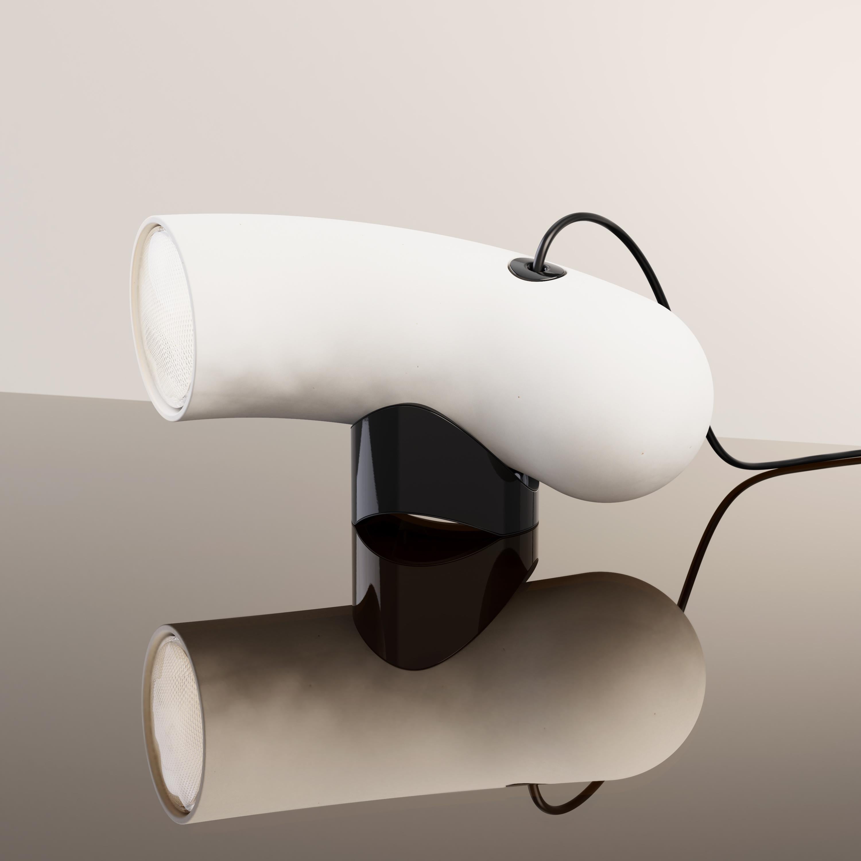 Porcelain Hyphen Simple table lamp by Darmes
Dimensions: D 11 x W 32 x H 15 cm
Materials: Matte white porcelain.
Available in steel sandy black, steel chromatic black, natural porcelain and steel custom.

Derived from the ancient Greek ?f’ ?? (huph’