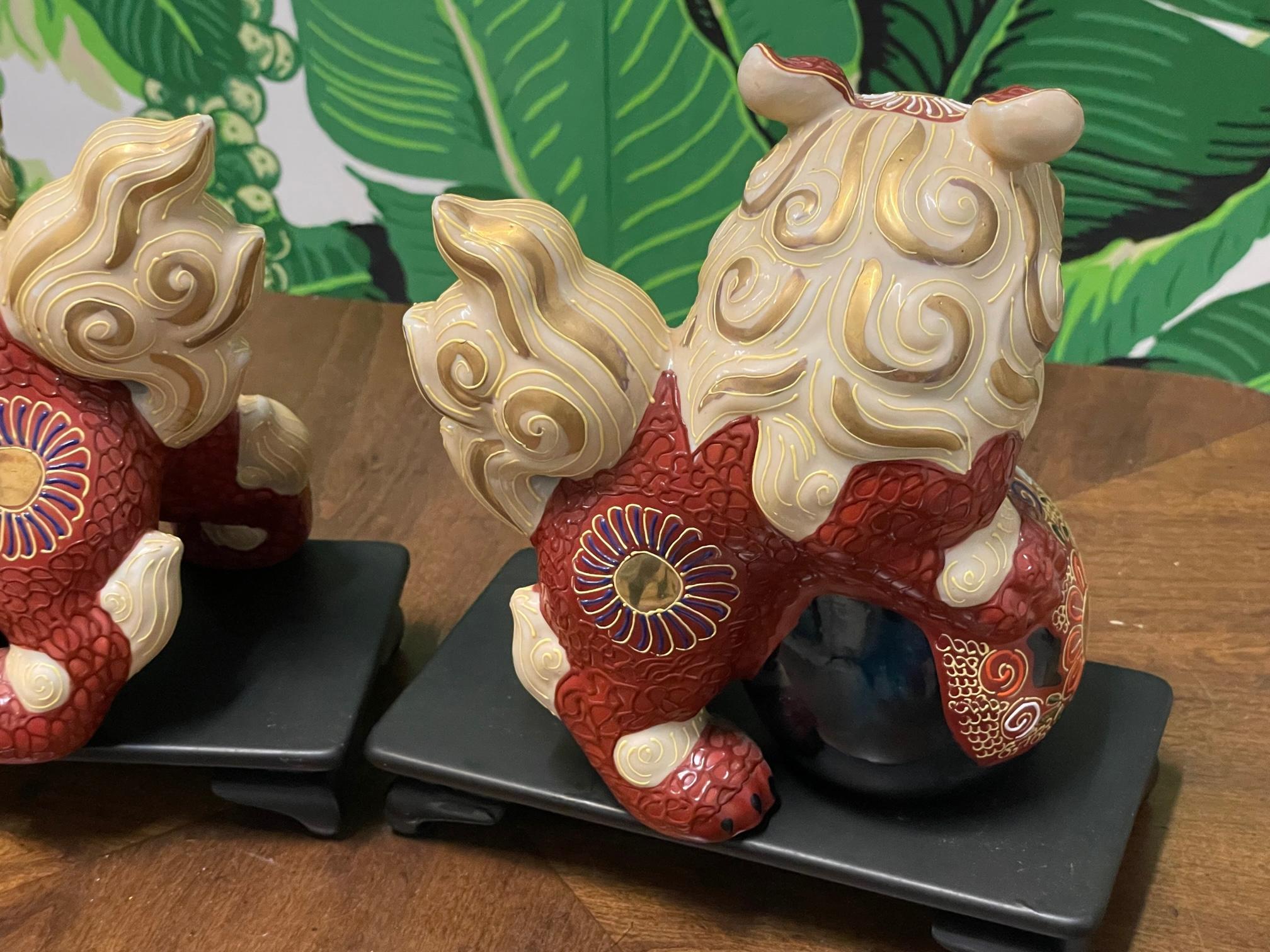 Porcelain Japanese Cinnabar Foo Dog Figurines on Stands In Good Condition For Sale In Jacksonville, FL
