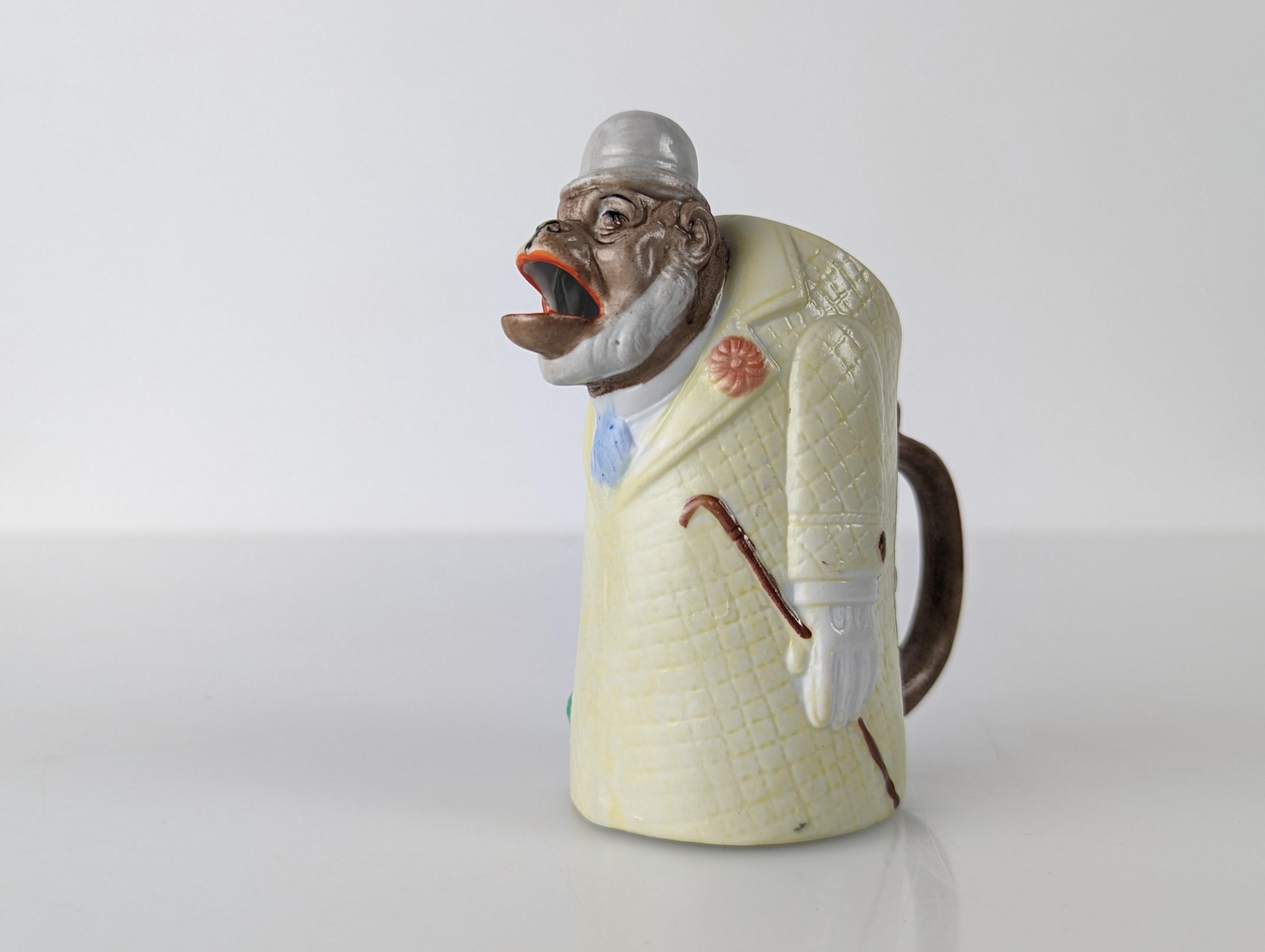 Discover the magic of Schafer Vater porcelain with this charming elegant monkey pitcher! Originating in Volkstedt Rudolstadt, Germany, between 1890 and 1962, these playful and artistic figurines have captivated collectors and art lovers for