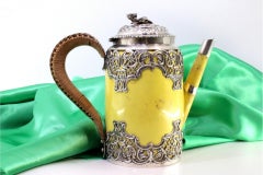 Porcelain kettle with silver cut structure, reliefs and flower-knob lid