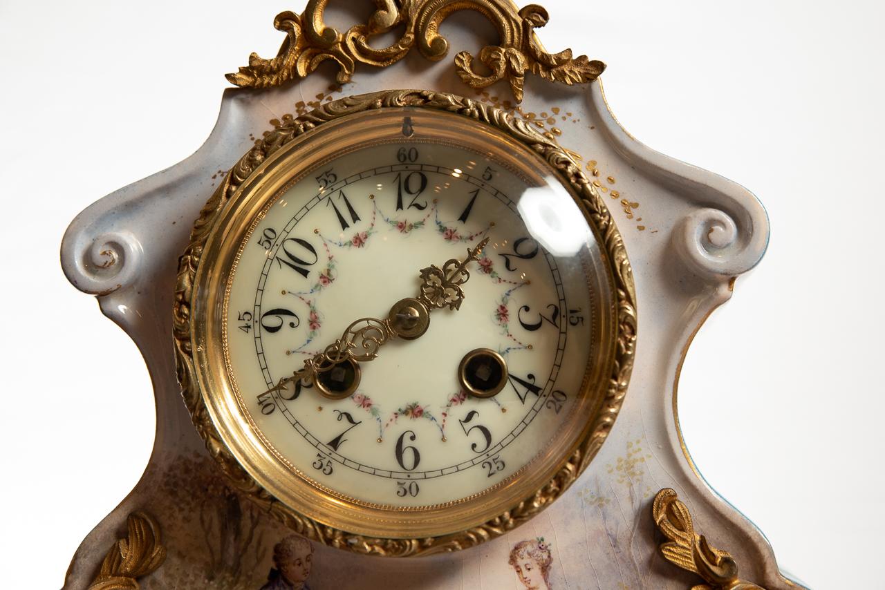 A rare 8 day striking the hours and half hours mantel clock signed by the makers and dated to the rear of the movement S Marti Paris, 1889.
The clock movement is housed in a wonderful, fine quality porcelain case, beautifully decorated with two