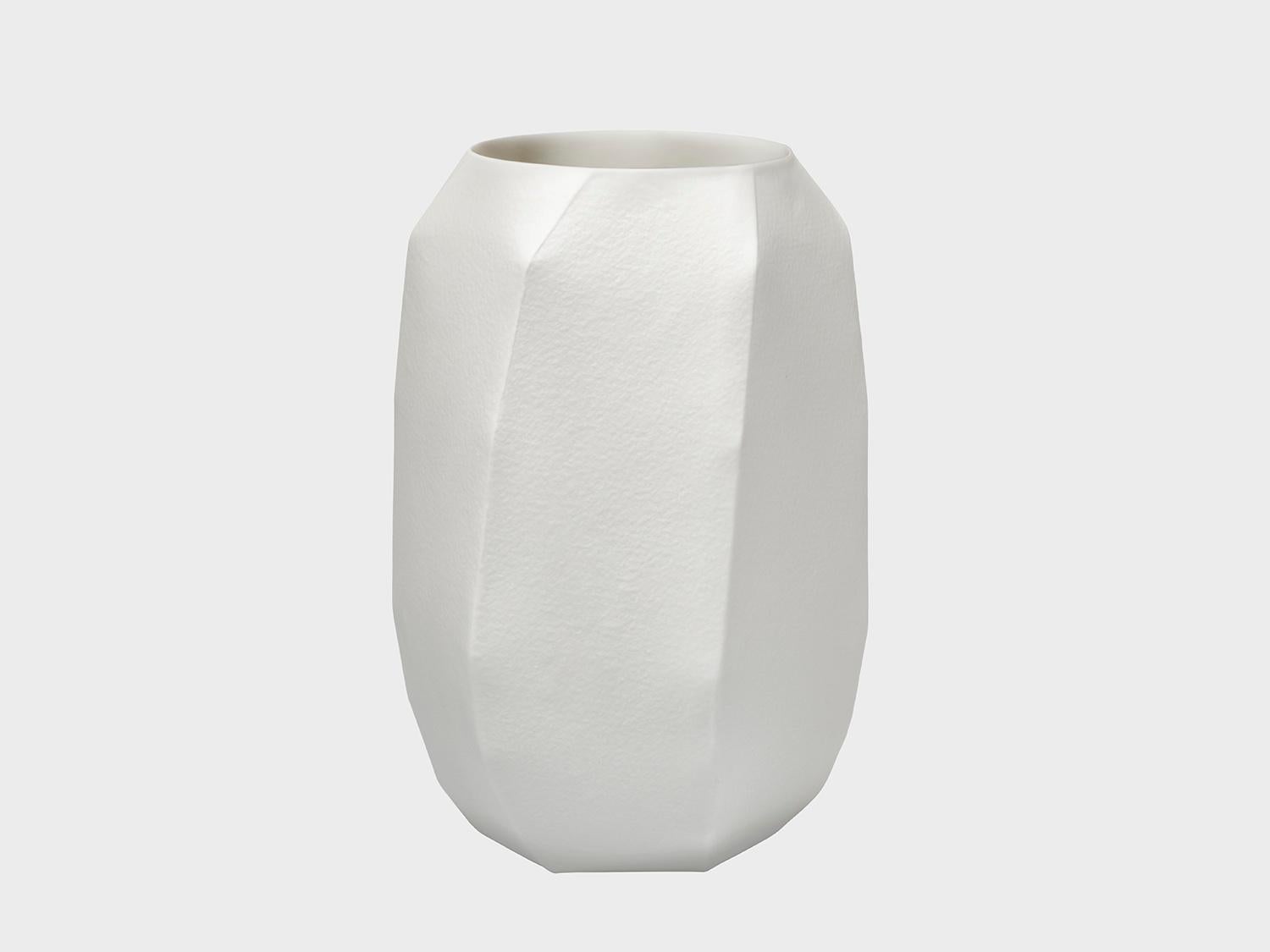 This set of three (small, medium, large) special edition May vases has the edition number 20/36. The outer surface is white bisque porcelain and has the texture of rough watercolor paper. They are an absolute must have. 

Designed by Ruth Gurvich -