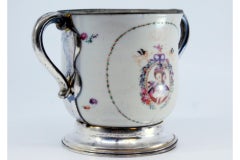 Porcelain mug with Japanese motifs, with silver base, handles and rim