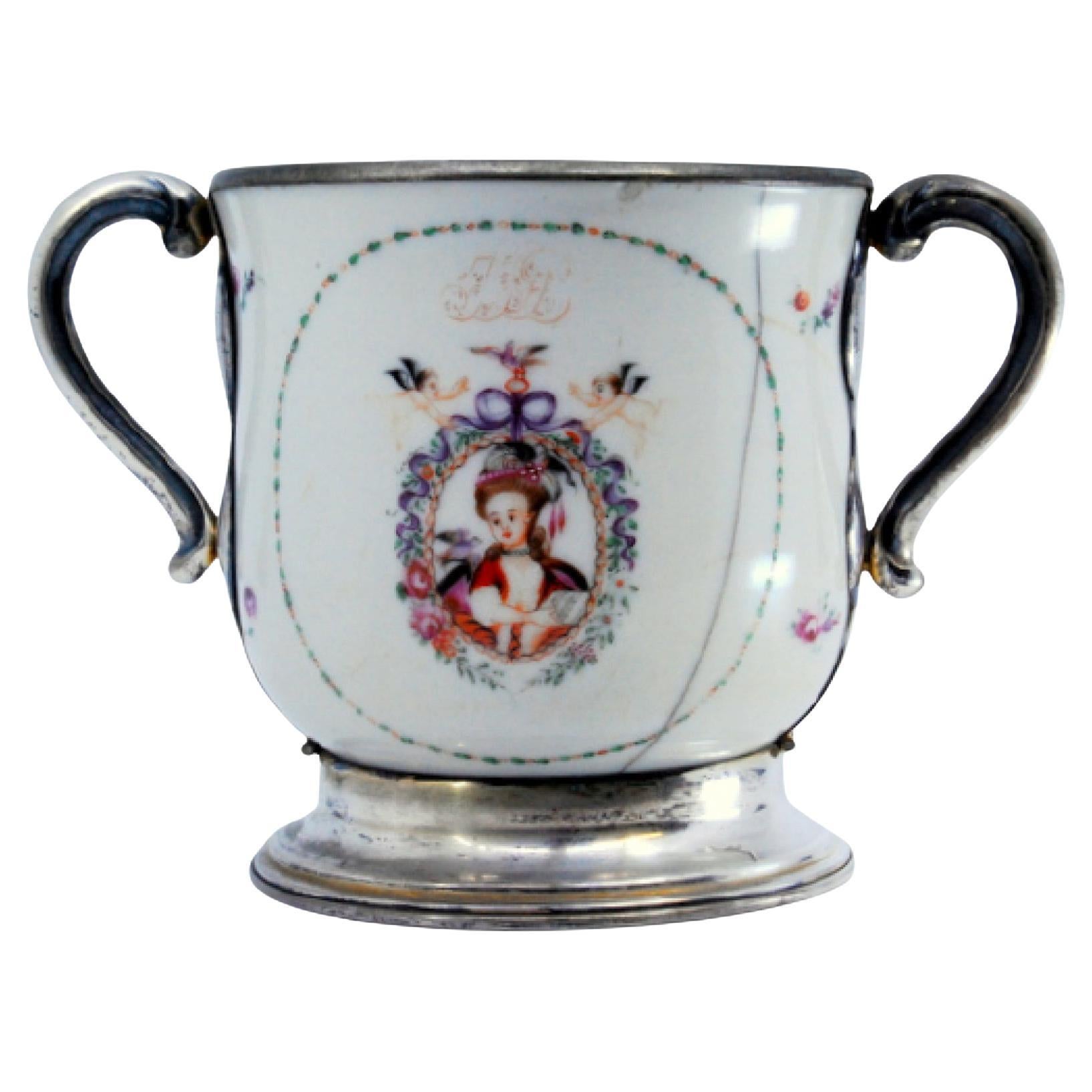 Porcelain mug with Japanese motifs, with silver base, handles and rim