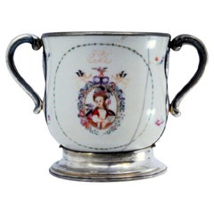 Porcelain mug with Japanese motifs, with silver base, handles and rim