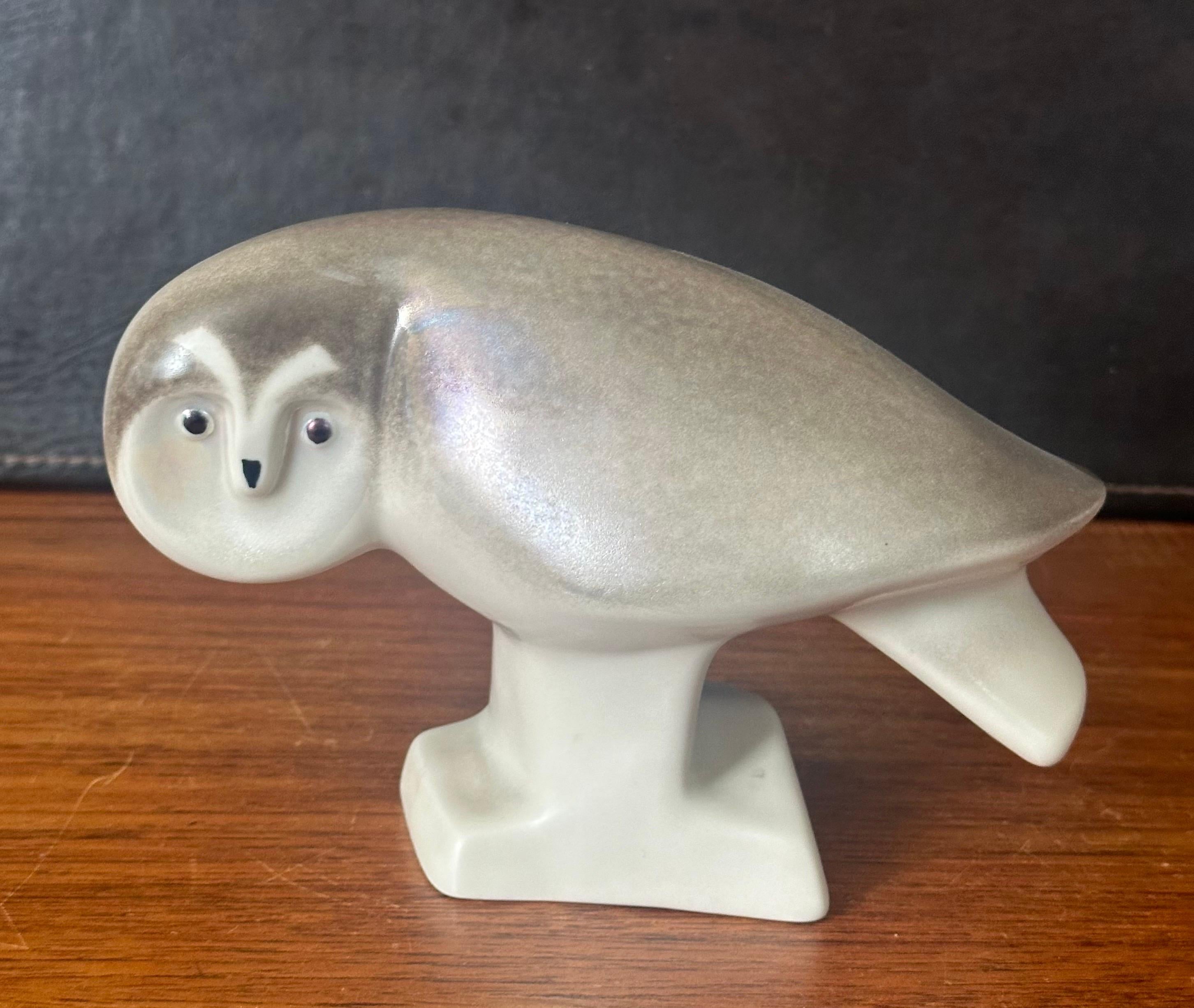 A hard to find porcelain owl sculpture by Lillemor Mannerheim for Arabia of Finland, circa 1980s.  Signed on the underside by the artist, the piece was produced as a limited special edition series for the World Wildlife Foundation (Panda mark).  The