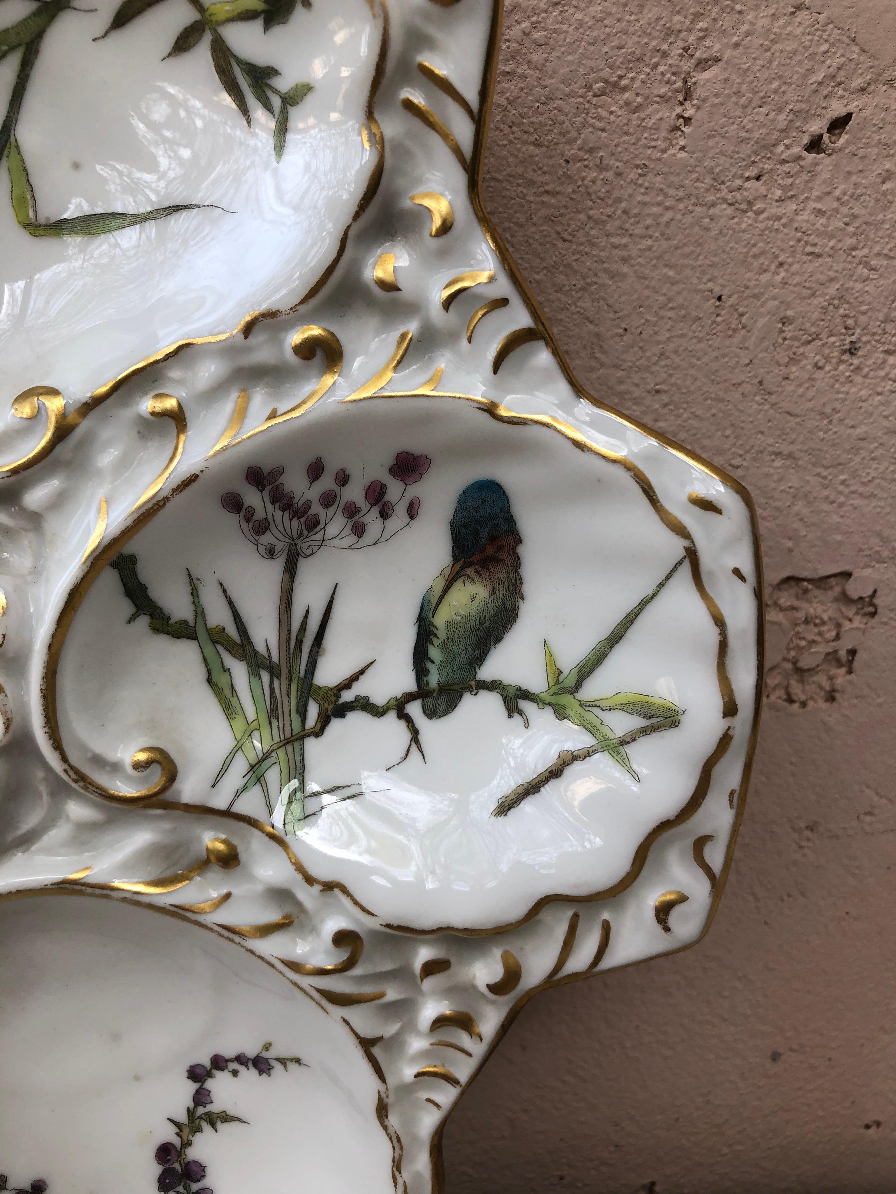 Rare Porcelain oyster plate signed Limoges Guerin & Company Paris.
Each shell have a different painting with birds or plants.